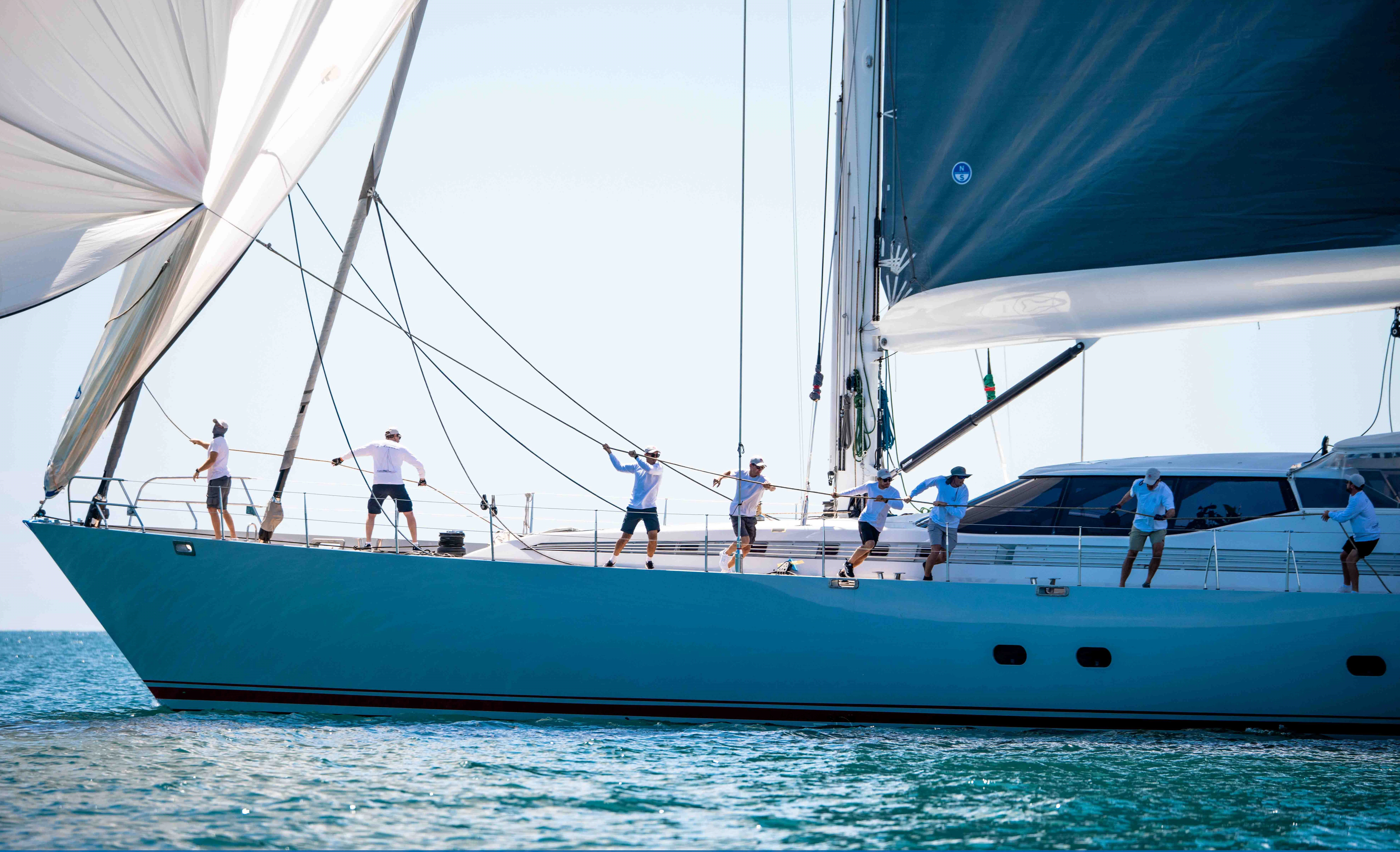 a group of people on a sailboat aboard RADIANCE Yacht for Charter