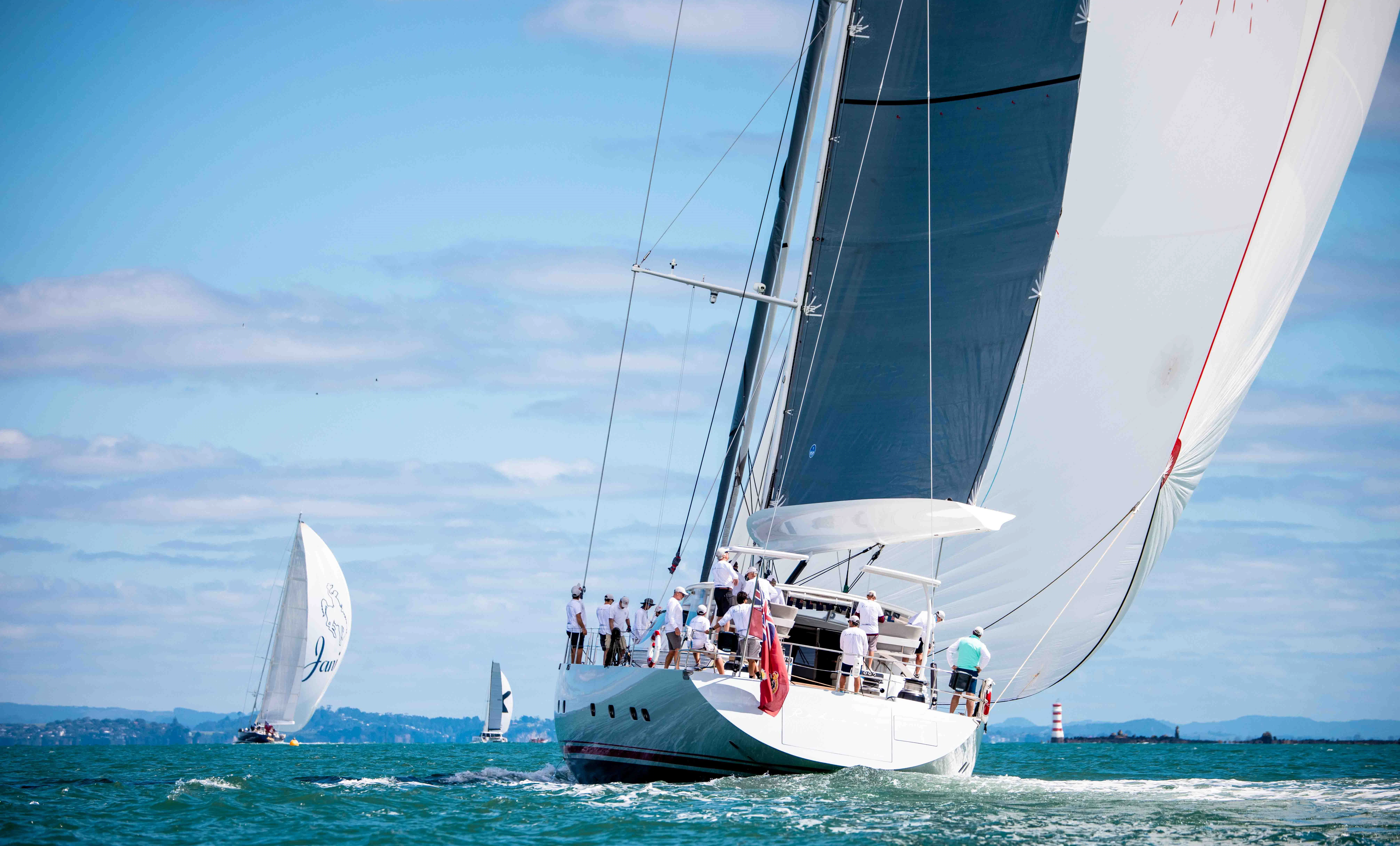 a group of people sailing on a sailboat aboard RADIANCE Yacht for Charter