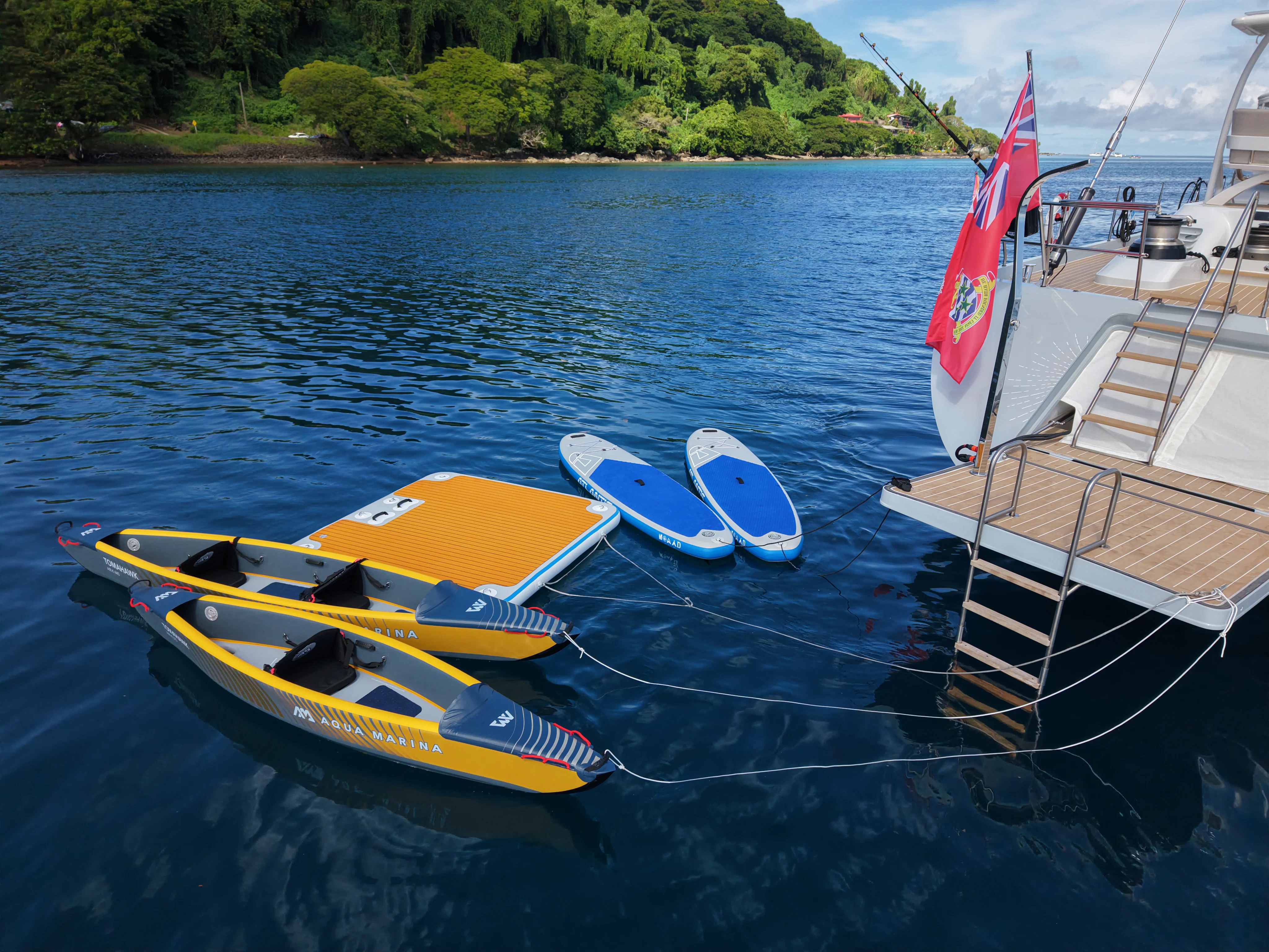 a couple of boats sit on the water aboard RADIANCE Yacht for Charter