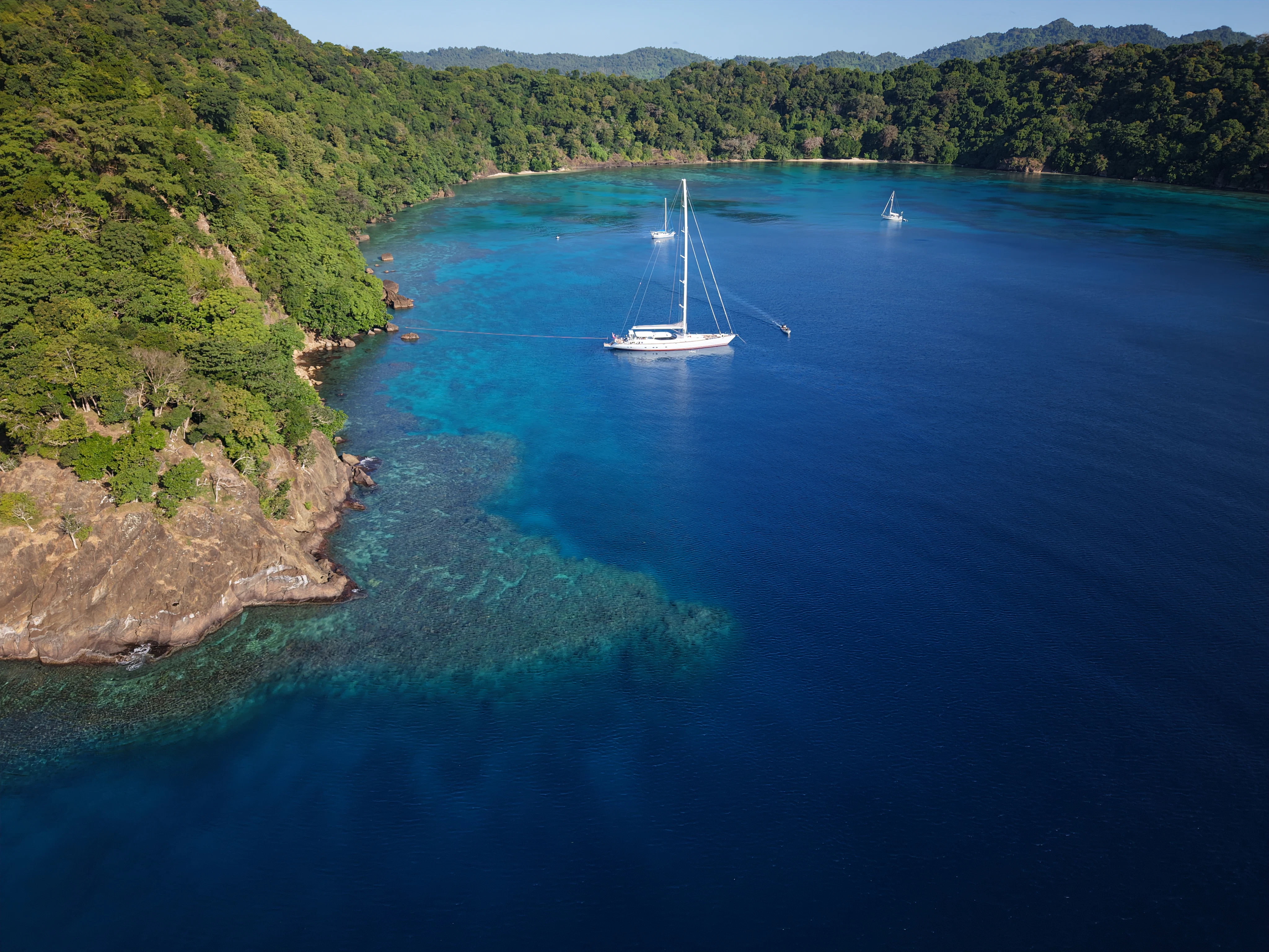 a boat sailing on the water aboard RADIANCE Yacht for Charter