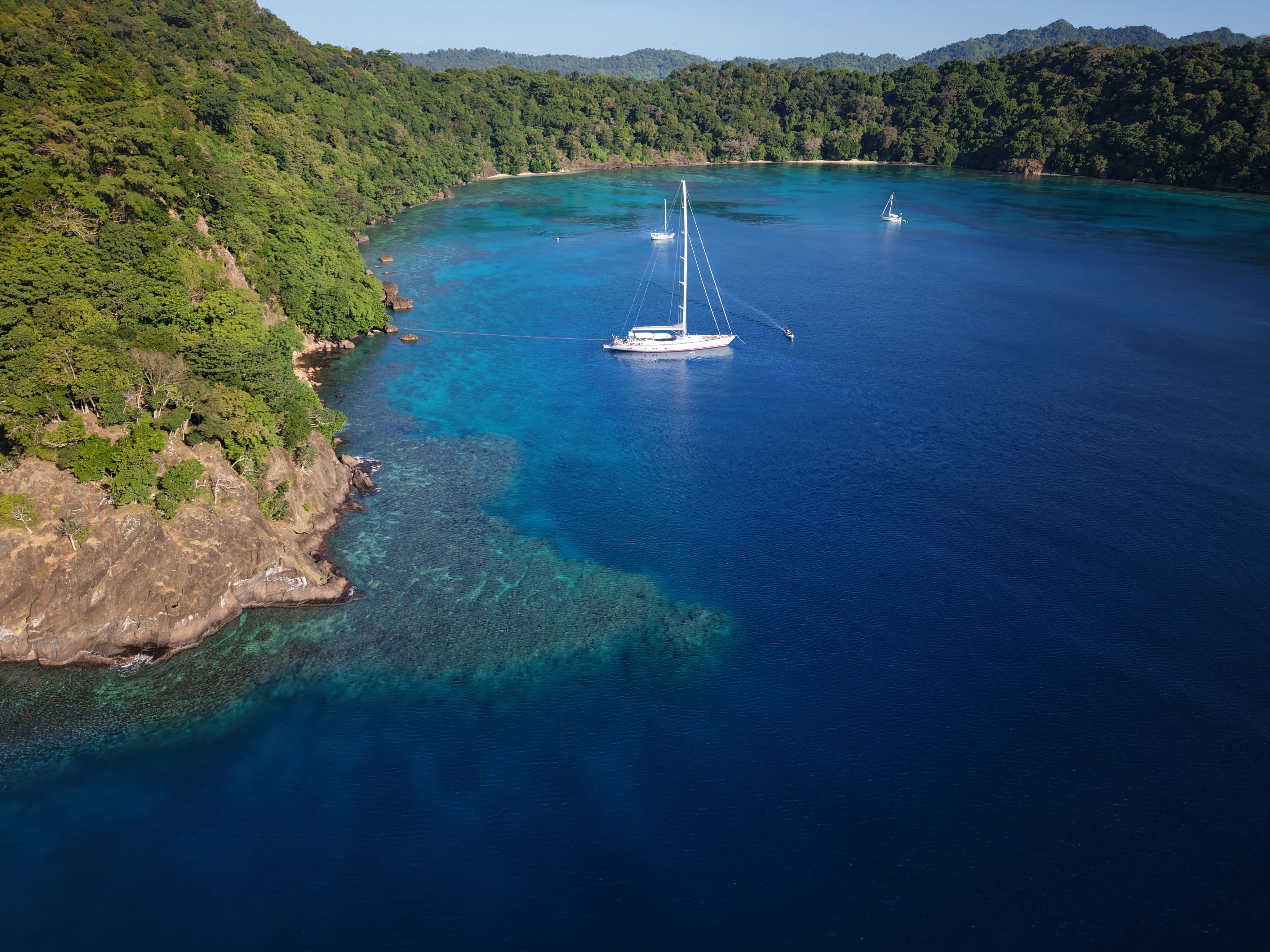 a boat sailing on the water aboard RADIANCE Yacht for Charter