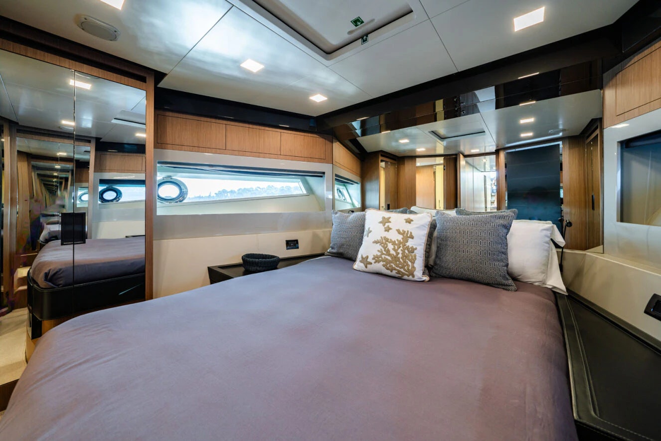 a bed in a room aboard XANADU 76 Yacht for Sale