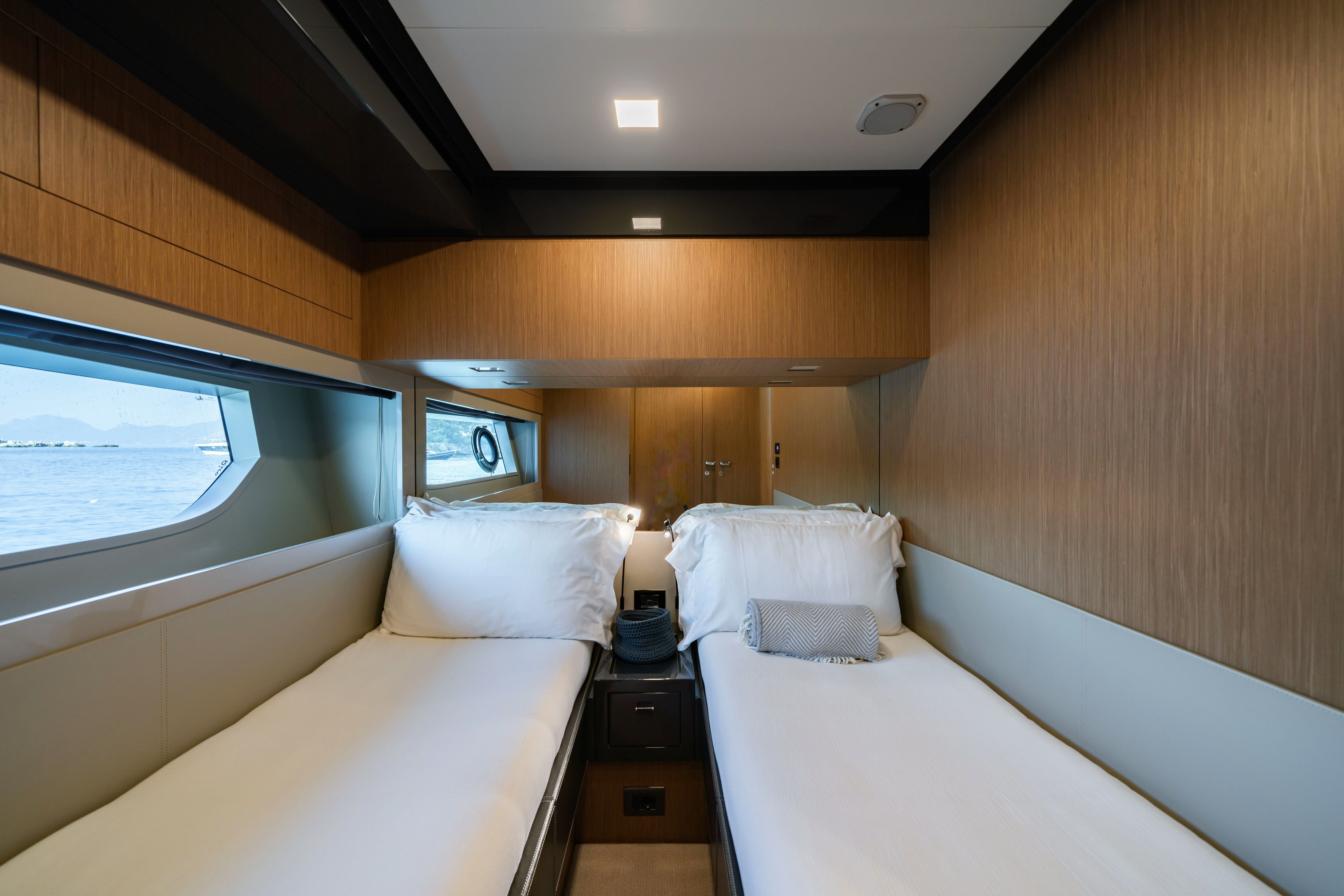 a room with two beds aboard XANADU 76 Yacht for Sale
