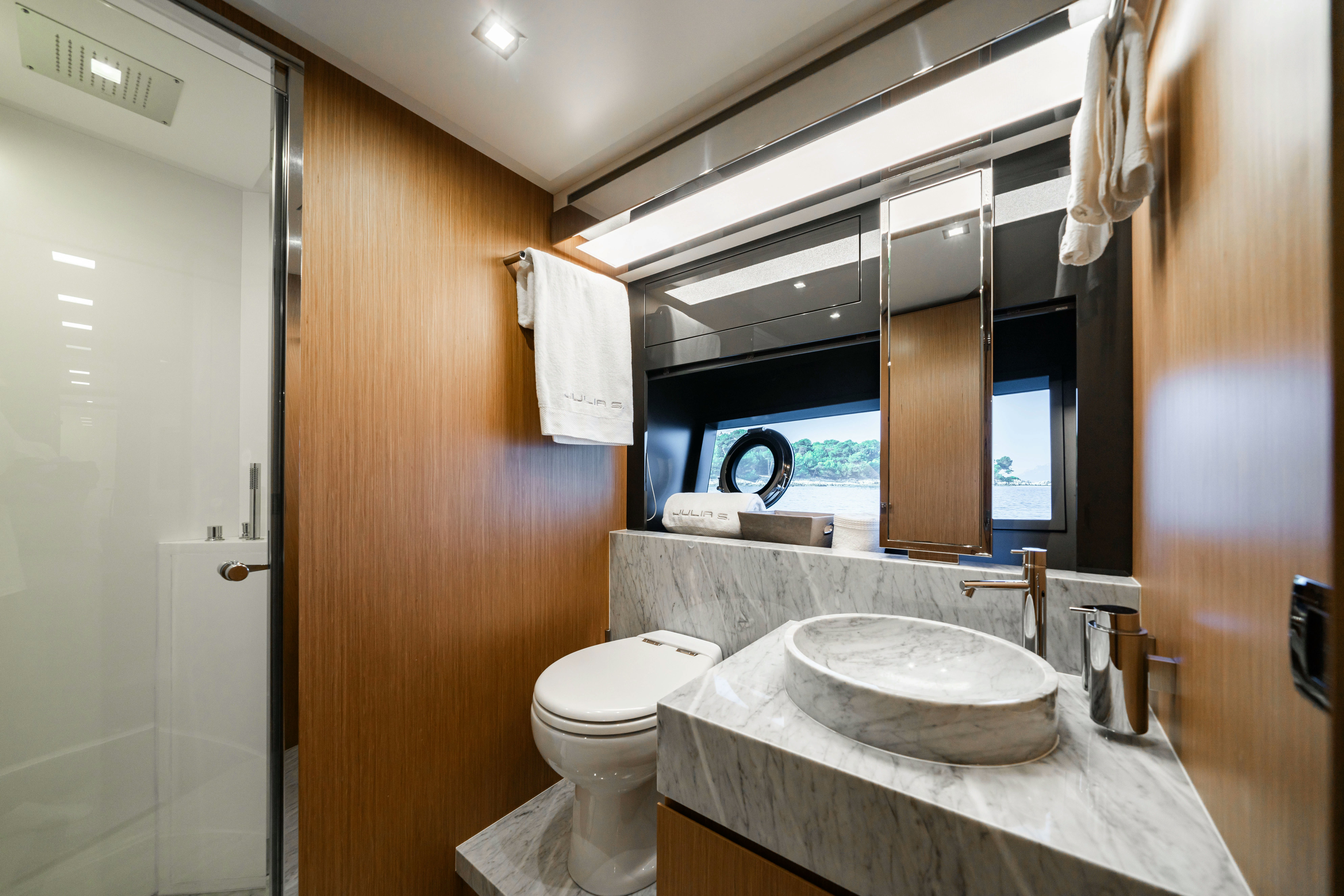a bathroom with a sink and toilet aboard XANADU 76 Yacht for Sale