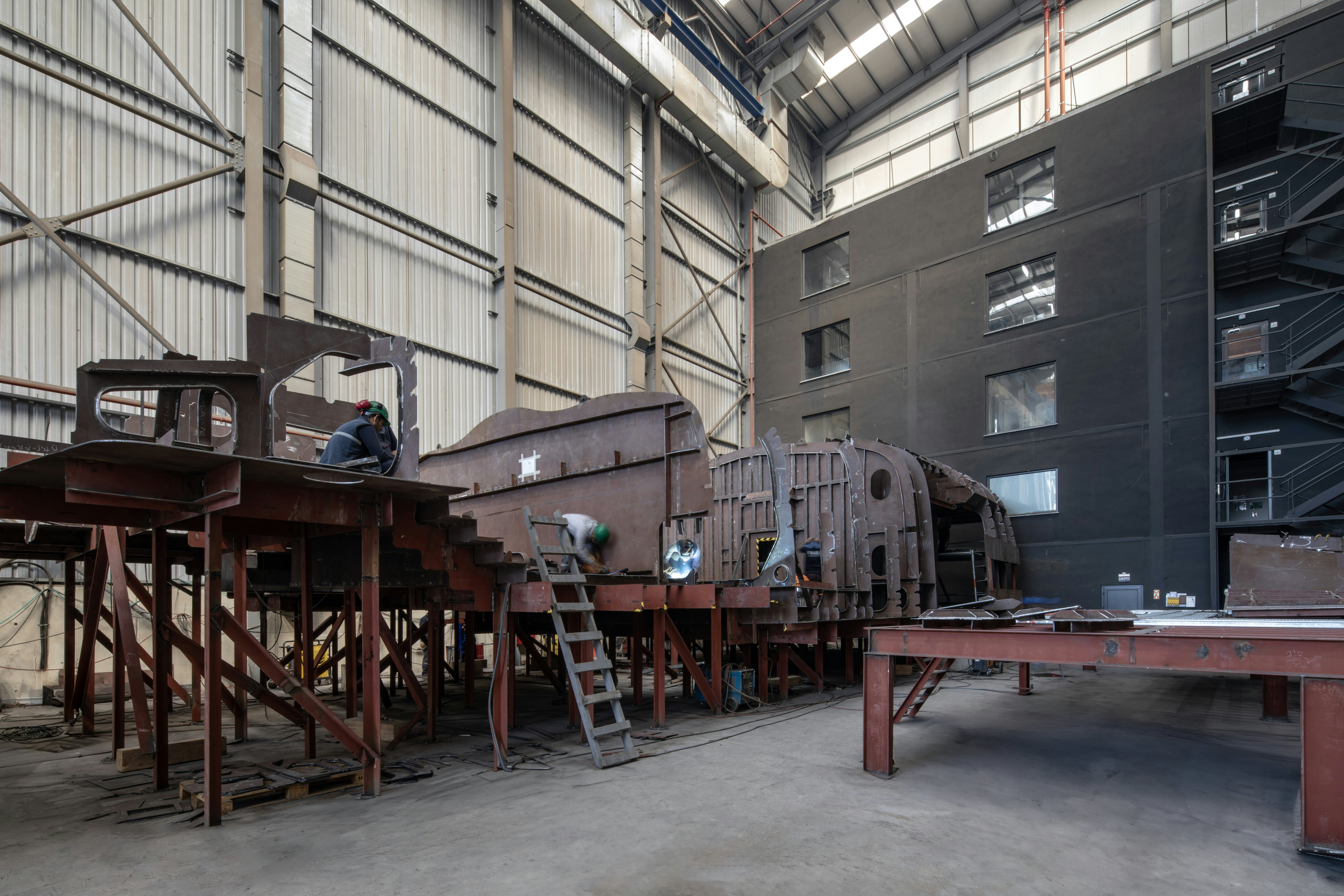 a large factory with wooden tables aboard SIRENA 42M/01 Yacht for Sale