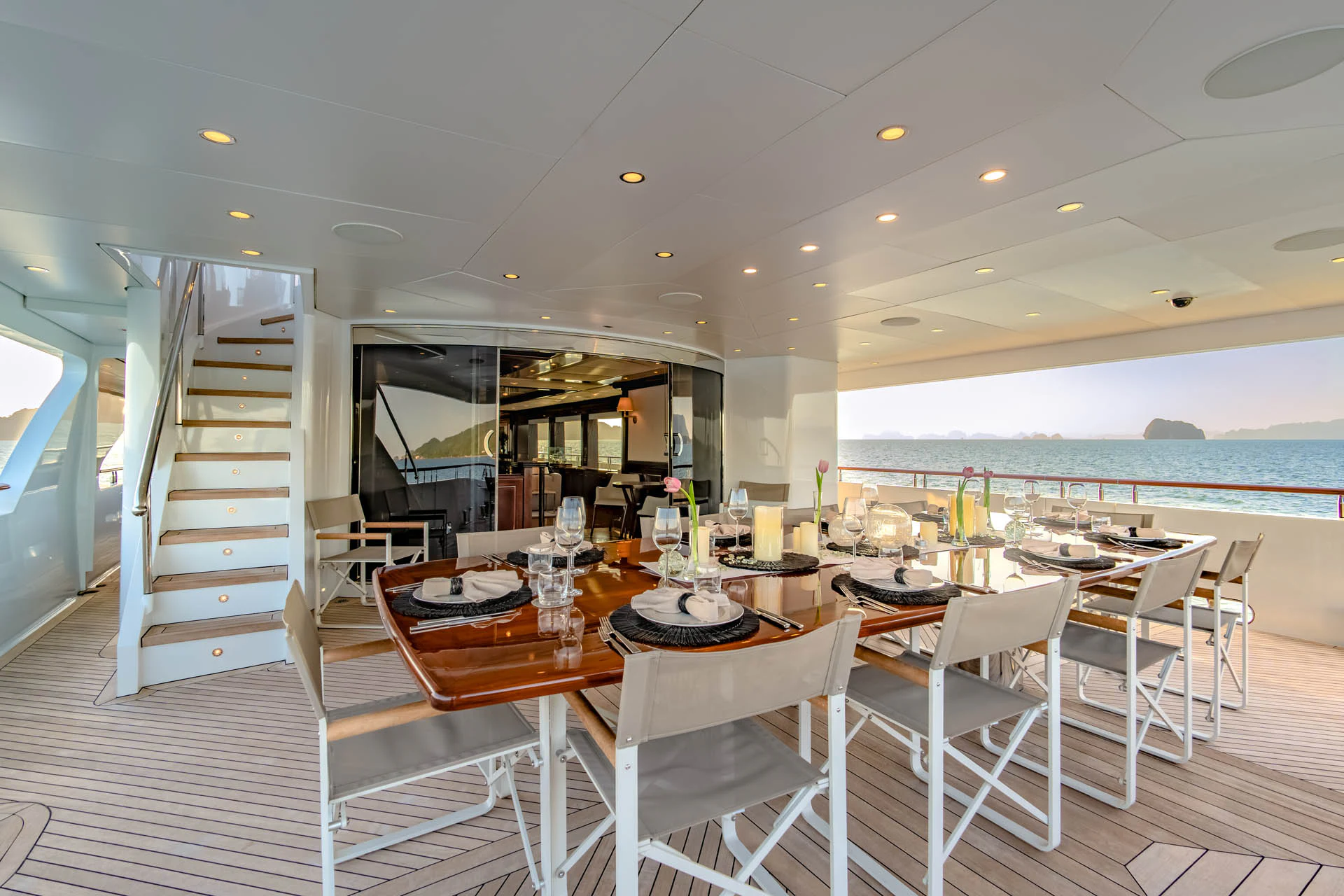 a dining room with a table and chairs aboard SWEET CAROLINE II Yacht for Sale