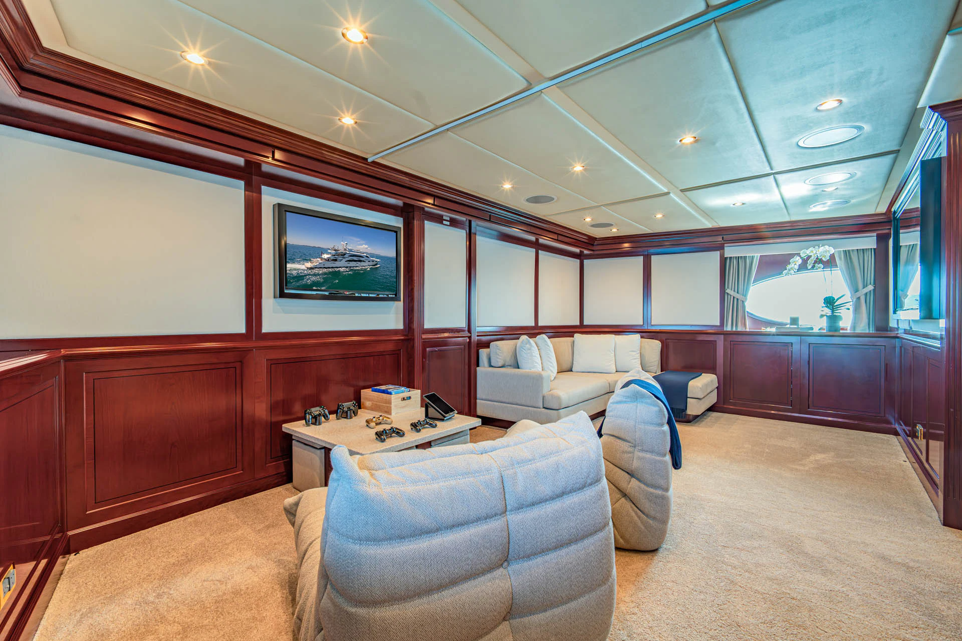 a room with a couch and a table aboard SWEET CAROLINE II Yacht for Sale