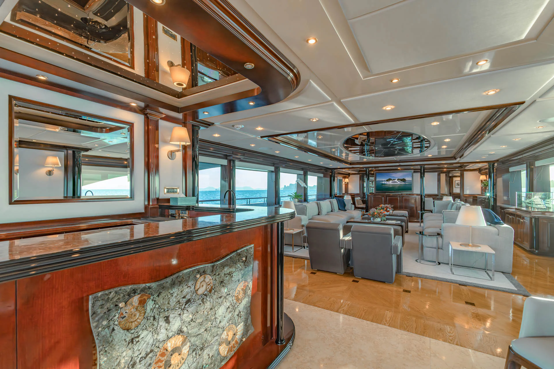 inside of a building with a couch and a table aboard SWEET CAROLINE II Yacht for Sale