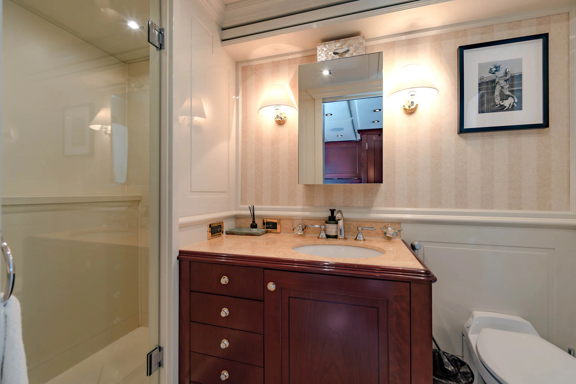 a bathroom with a sink and a mirror aboard SWEET CAROLINE II Yacht for Sale