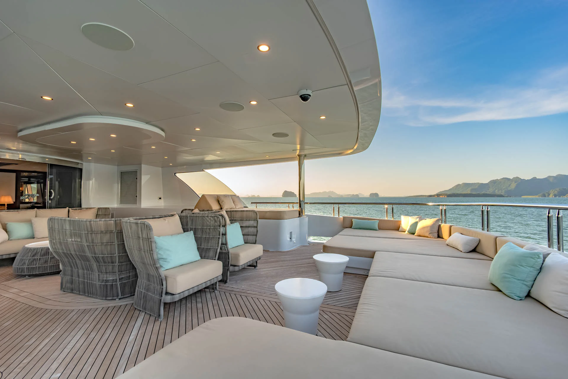 a large living room with a large balcony overlooking the ocean aboard SWEET CAROLINE II Yacht for Sale