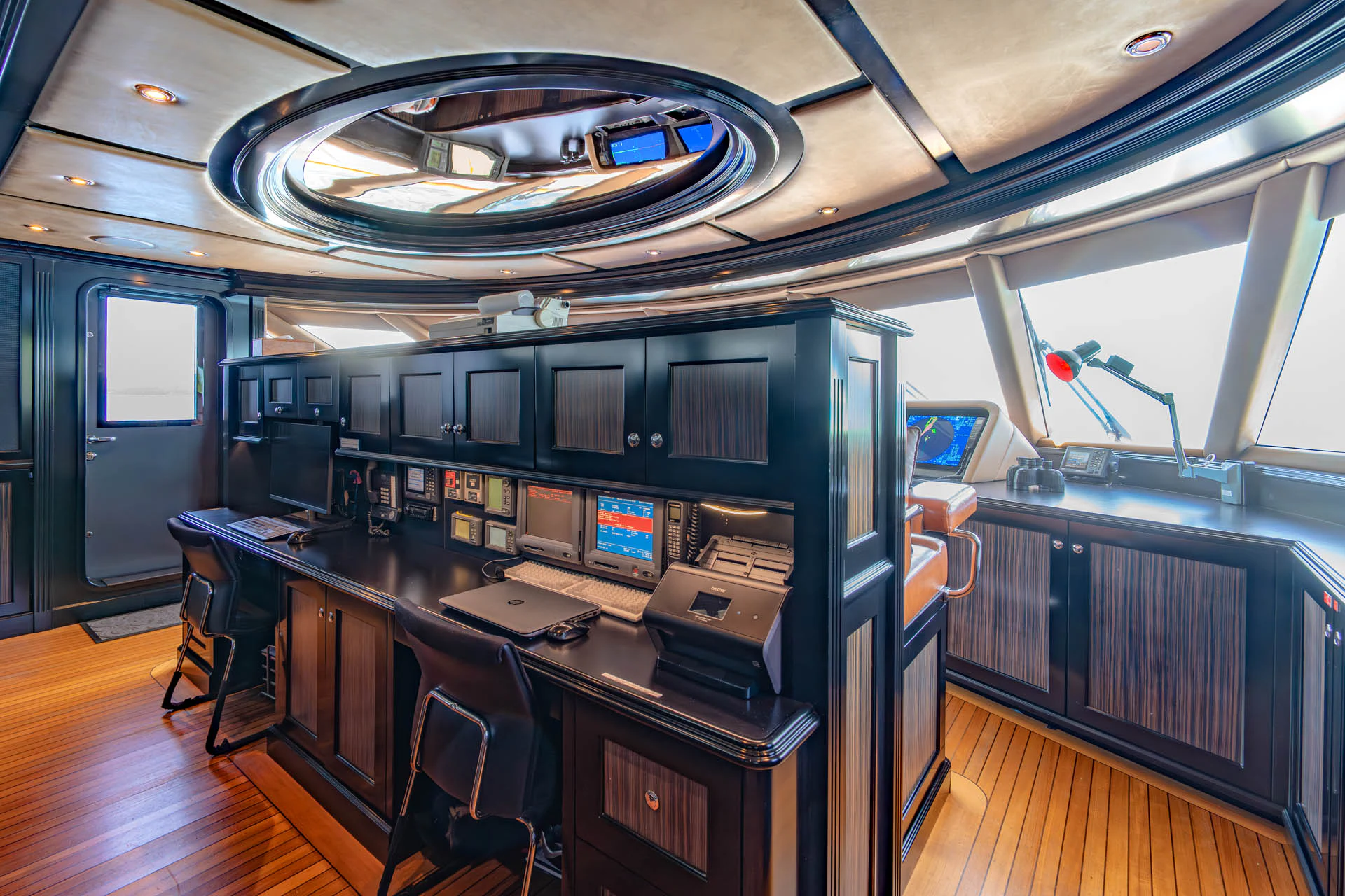 a room with a desk and chairs aboard SWEET CAROLINE II Yacht for Sale