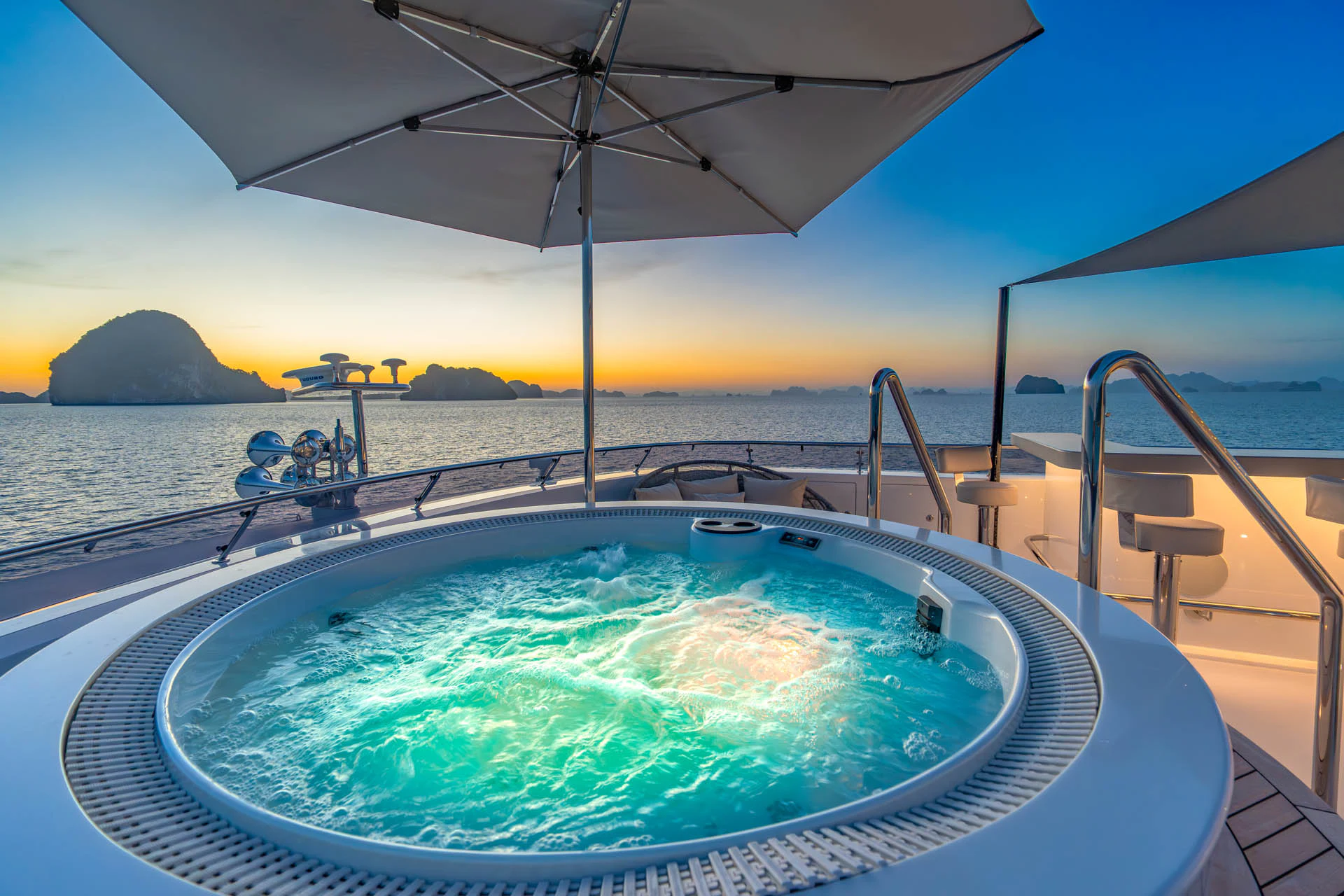 a large pool with a large umbrella aboard SWEET CAROLINE II Yacht for Sale