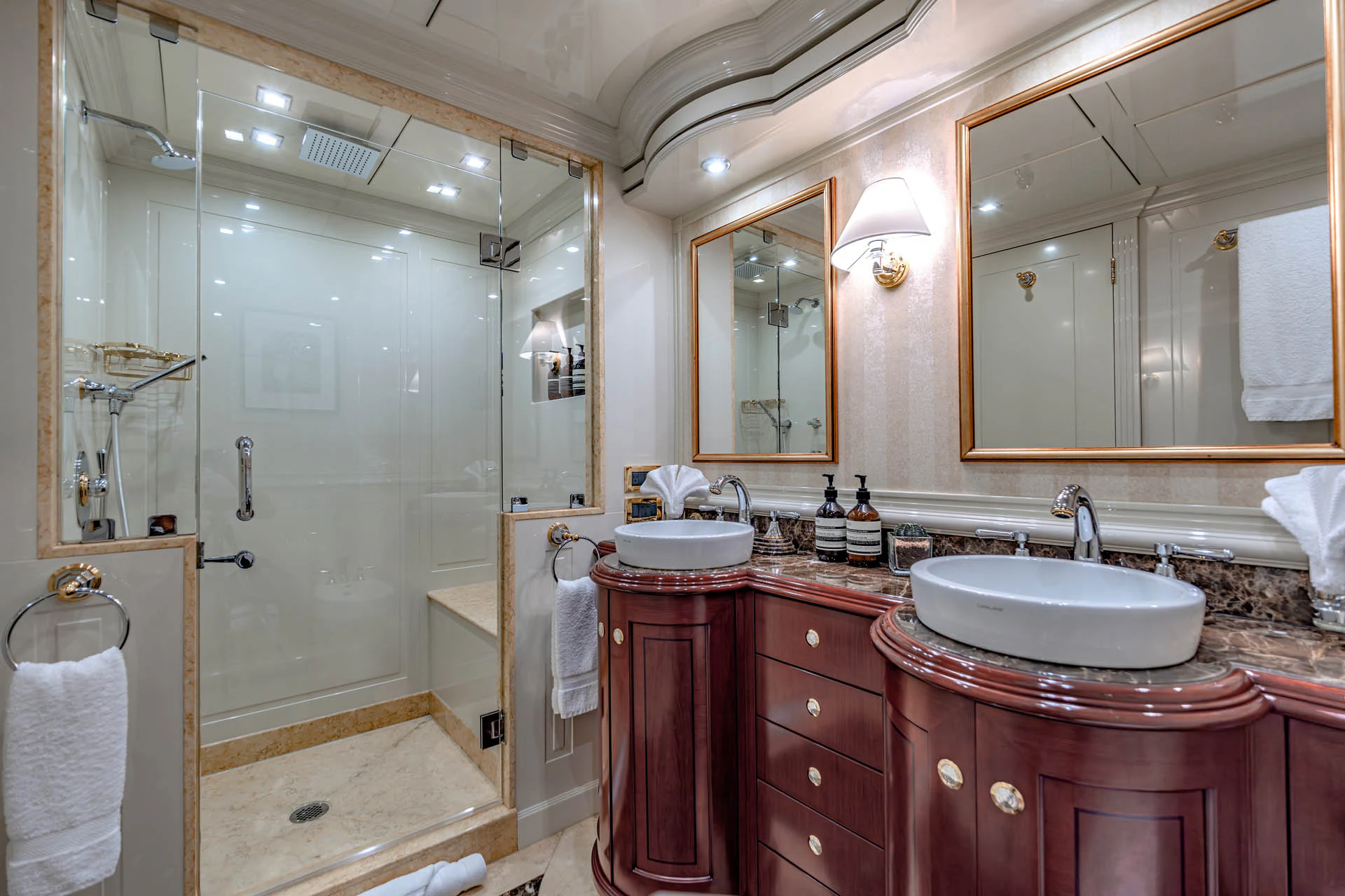 a bathroom with a shower and sink aboard SWEET CAROLINE II Yacht for Sale