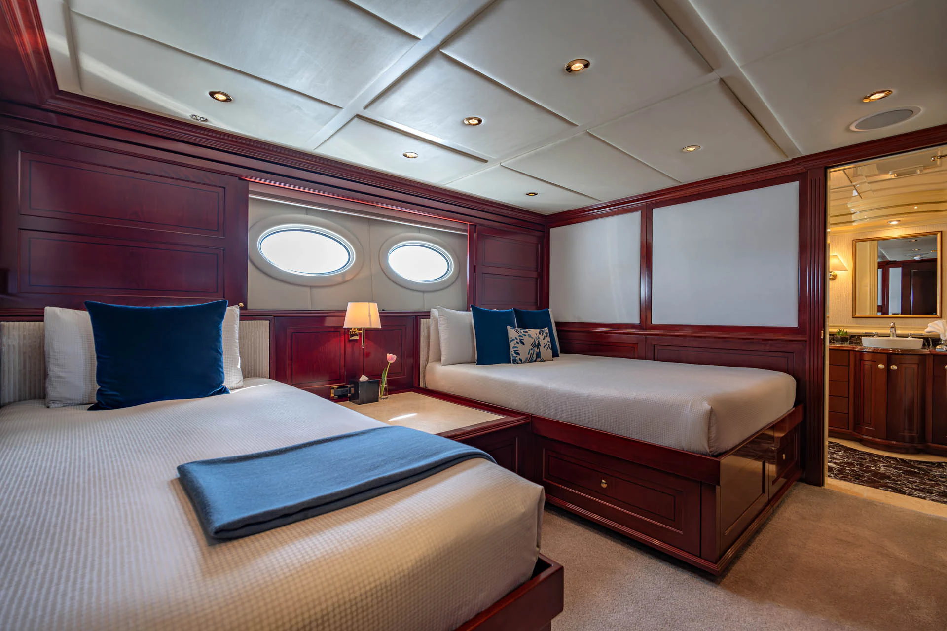 a room with a bed and a desk aboard SWEET CAROLINE II Yacht for Sale