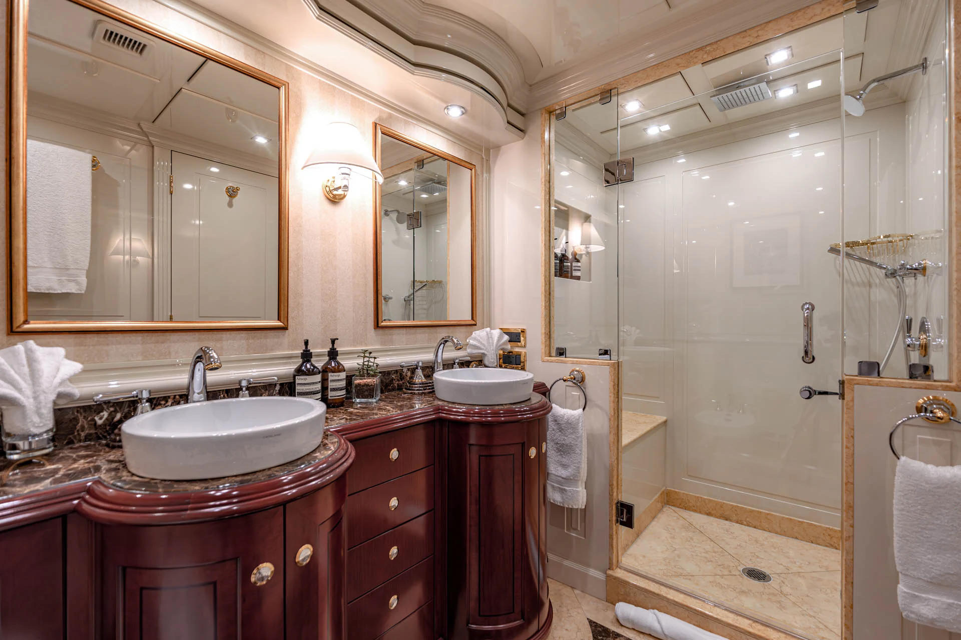 a bathroom with a sink and a mirror aboard SWEET CAROLINE II Yacht for Sale