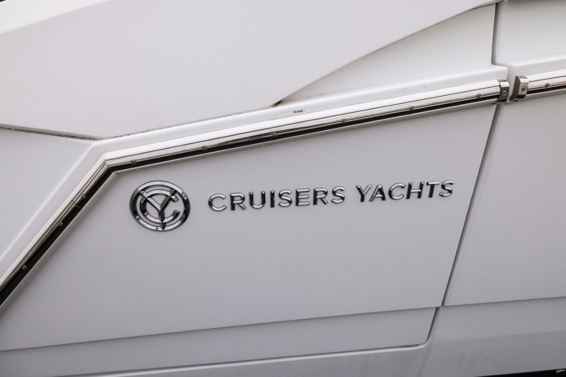 a white rectangular object with a silver logo on it aboard TRUE Yacht for Sale