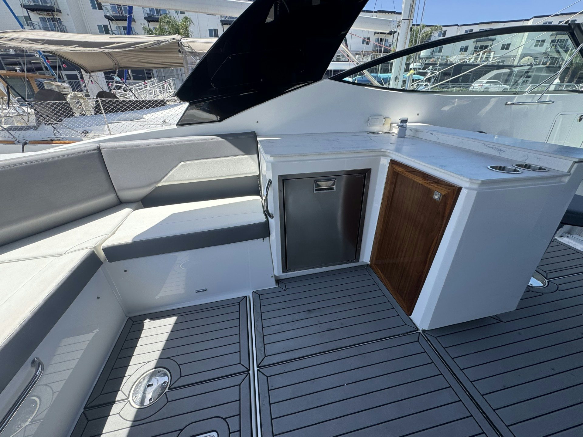 a deck with a grill and a barbecue grill aboard TRUE Yacht for Sale