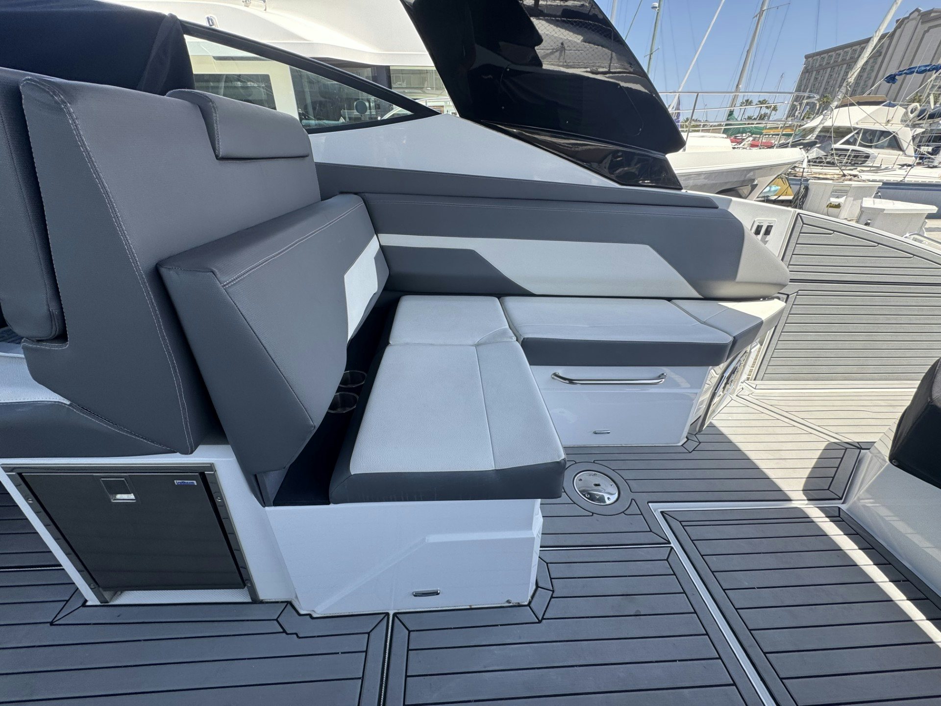 a car with a screen on the window aboard TRUE Yacht for Sale