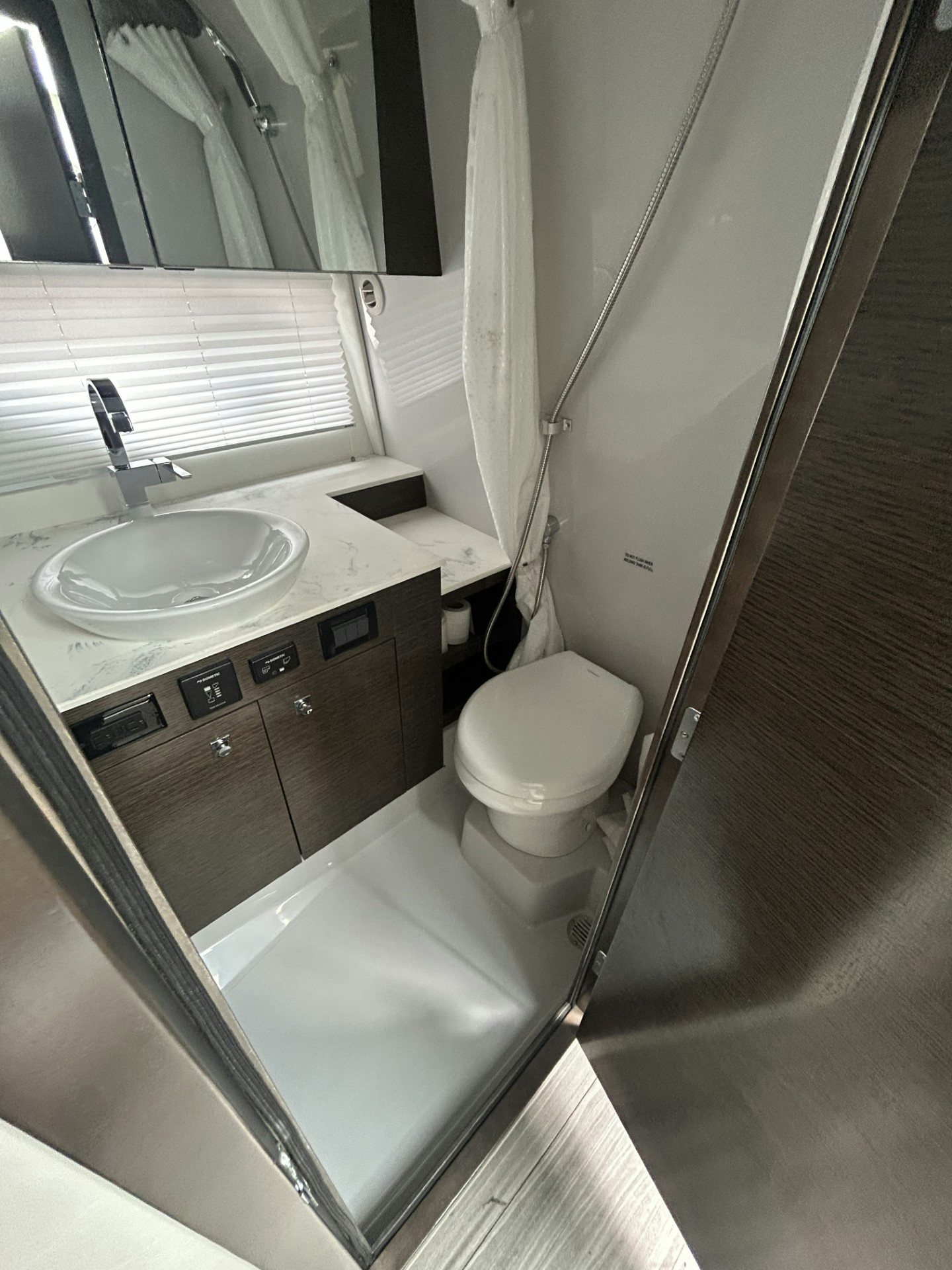 a bathroom with a sink and a toilet aboard TRUE Yacht for Sale