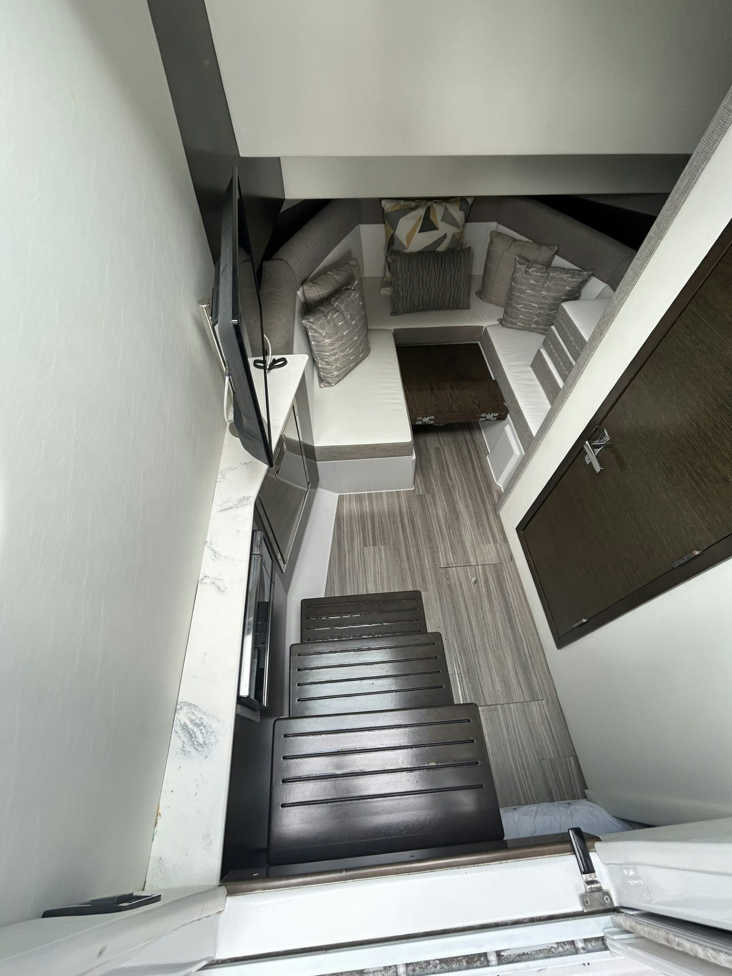 a room with a piano aboard TRUE Yacht for Sale