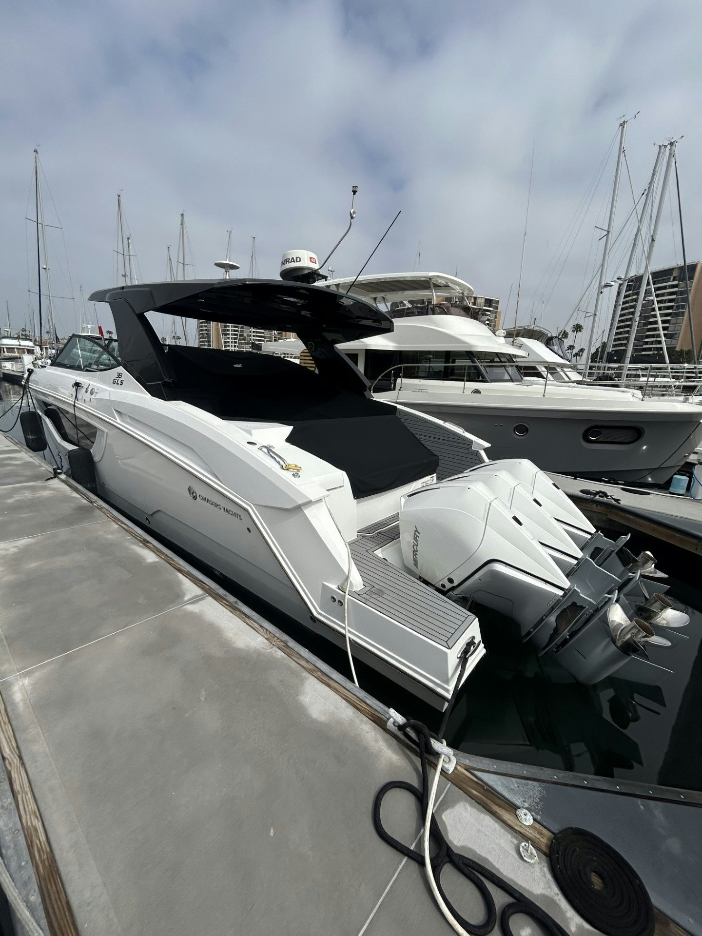 a row of boats on a dock aboard TRUE Yacht for Sale