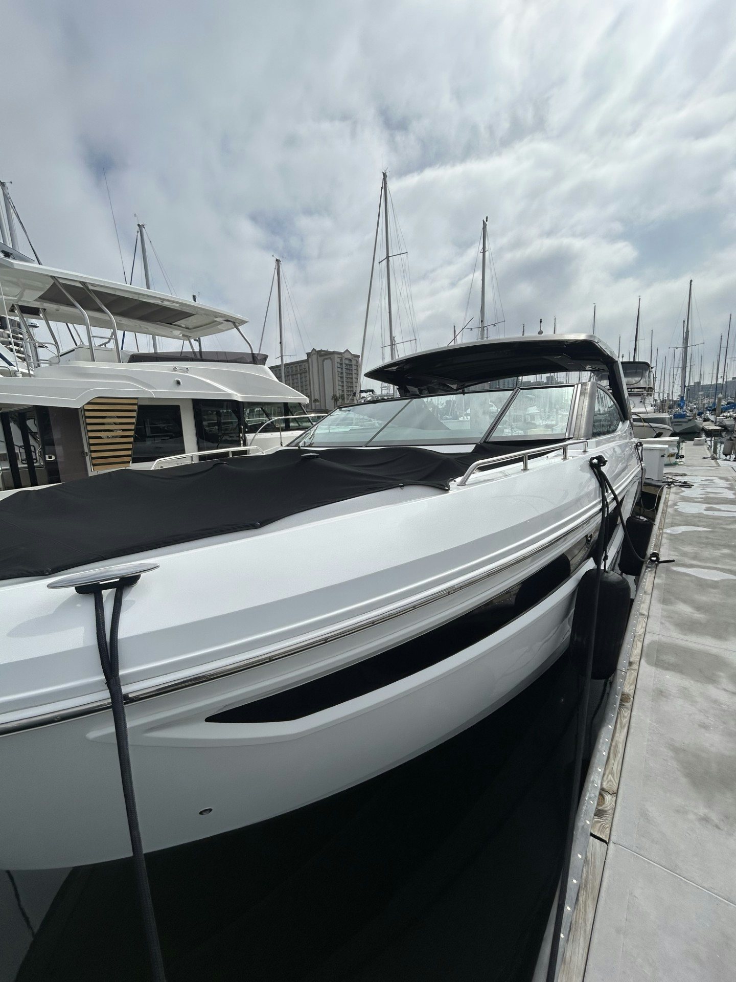 a boat parked in a harbor aboard TRUE Yacht for Sale