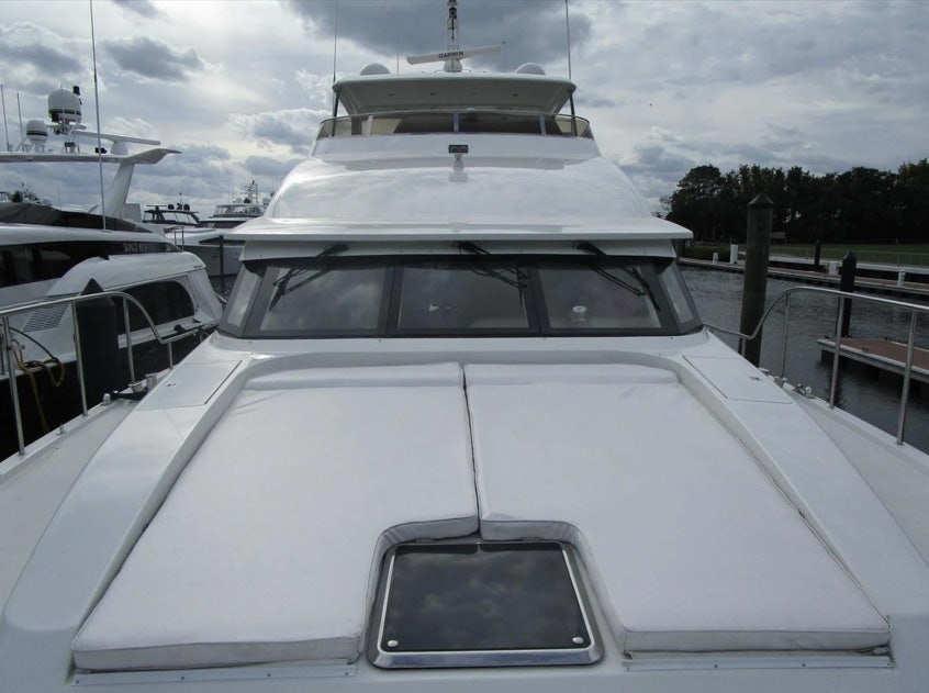 a white car with a white roof aboard FANCIER NANCI Yacht for Sale