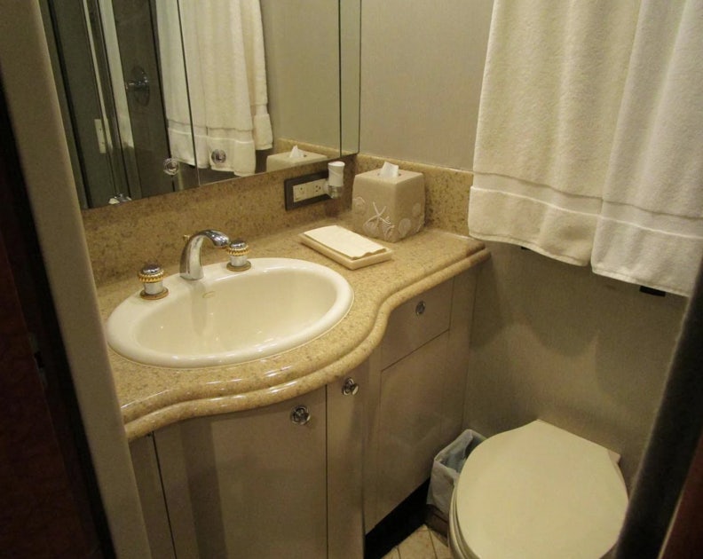 a bathroom with a sink and toilet aboard FANCIER NANCI Yacht for Sale