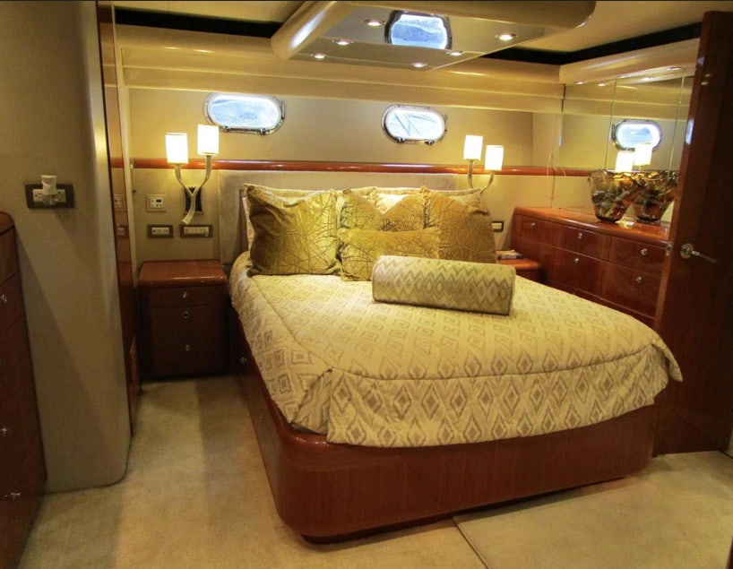 a bed in a room aboard FANCIER NANCI Yacht for Sale