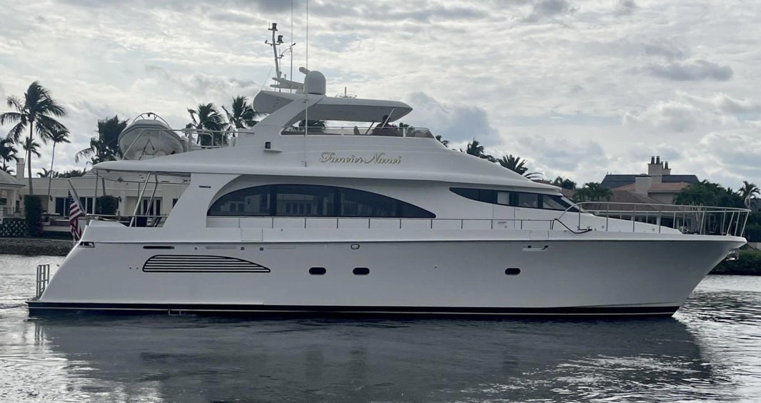 a white yacht on the water aboard FANCIER NANCI Yacht for Sale