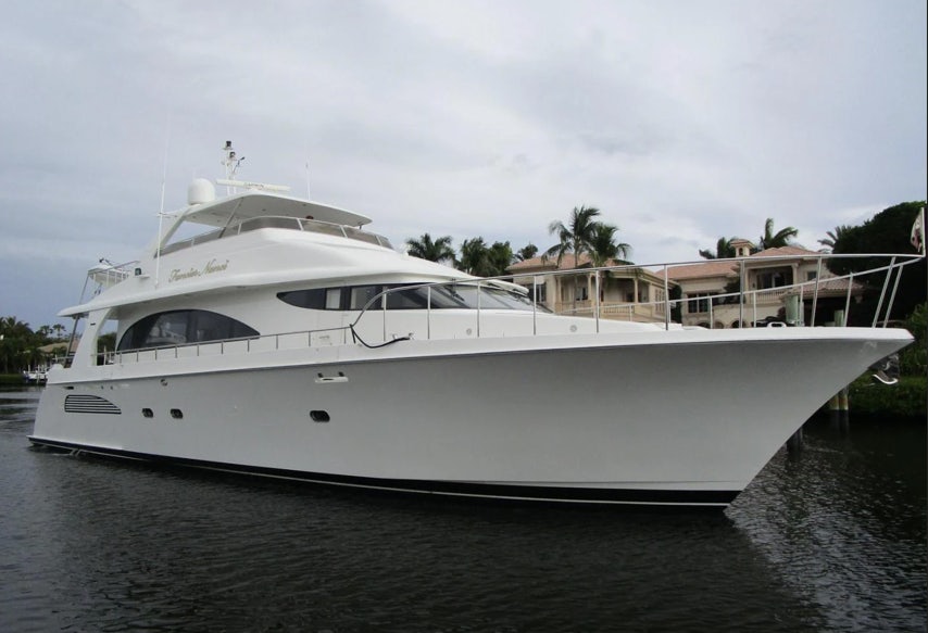 a white yacht on the water aboard FANCIER NANCI Yacht for Sale