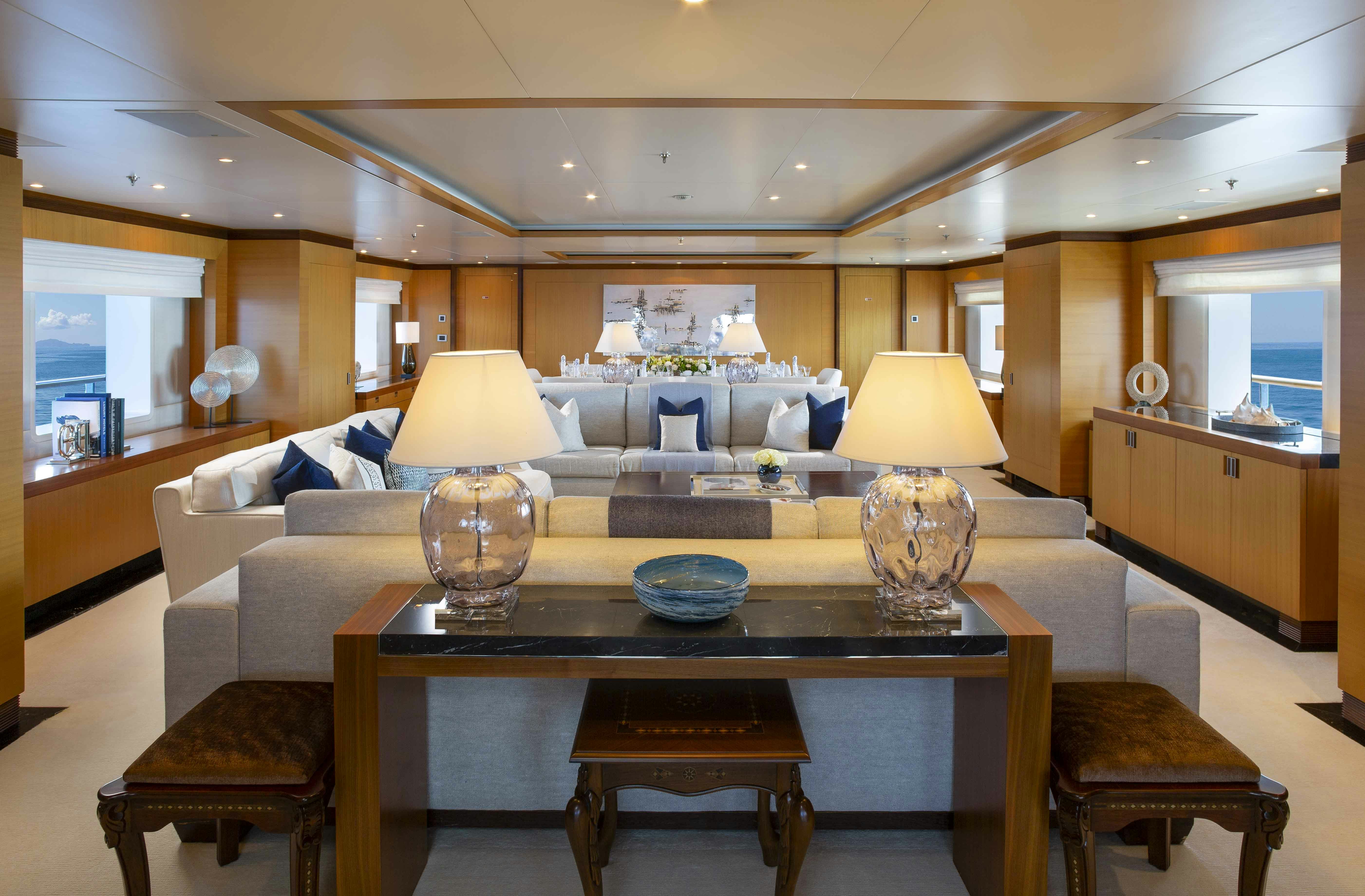 a living room with a table and chairs aboard LA BLANCA Yacht for Charter