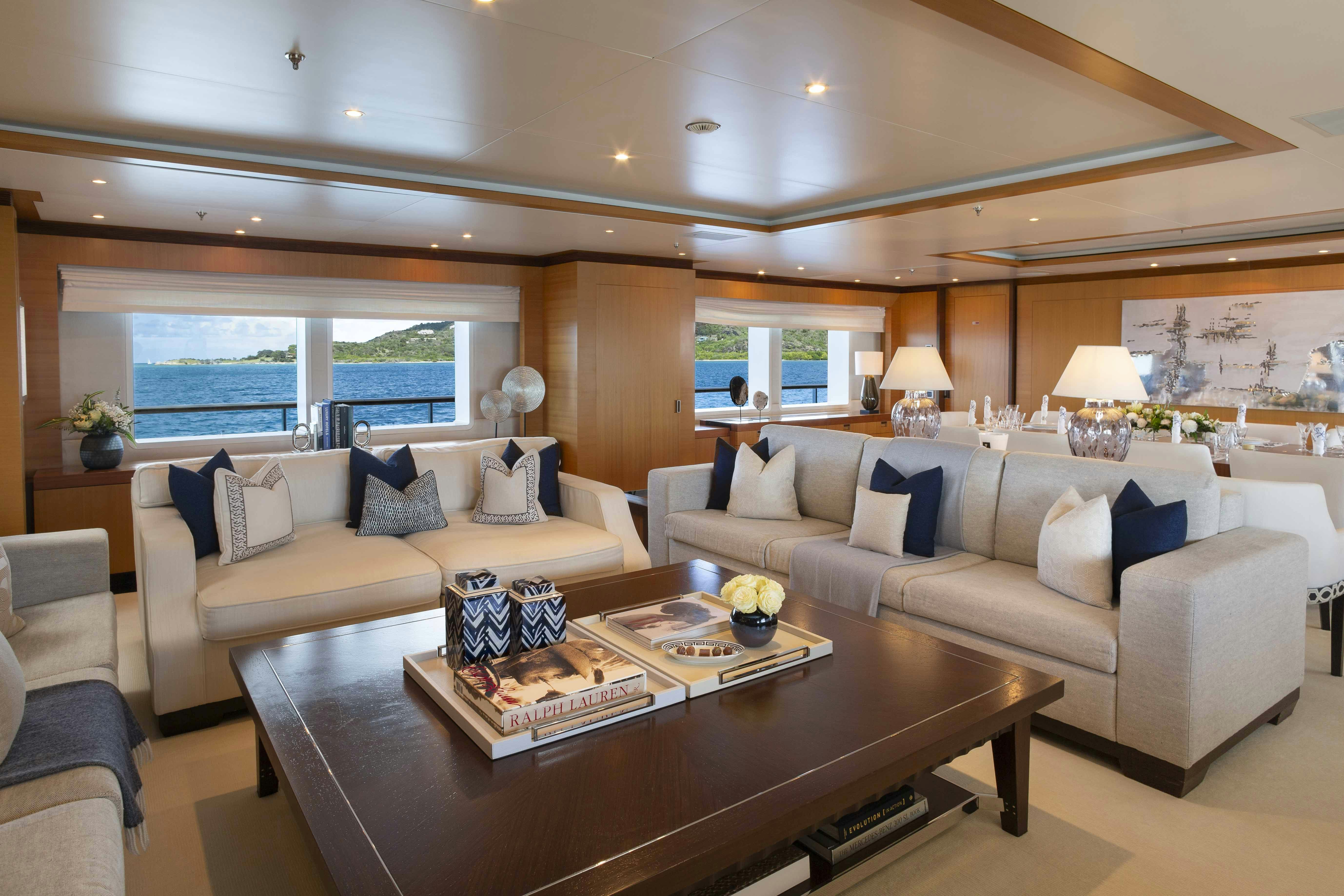 a living room with a large window aboard LA BLANCA Yacht for Charter