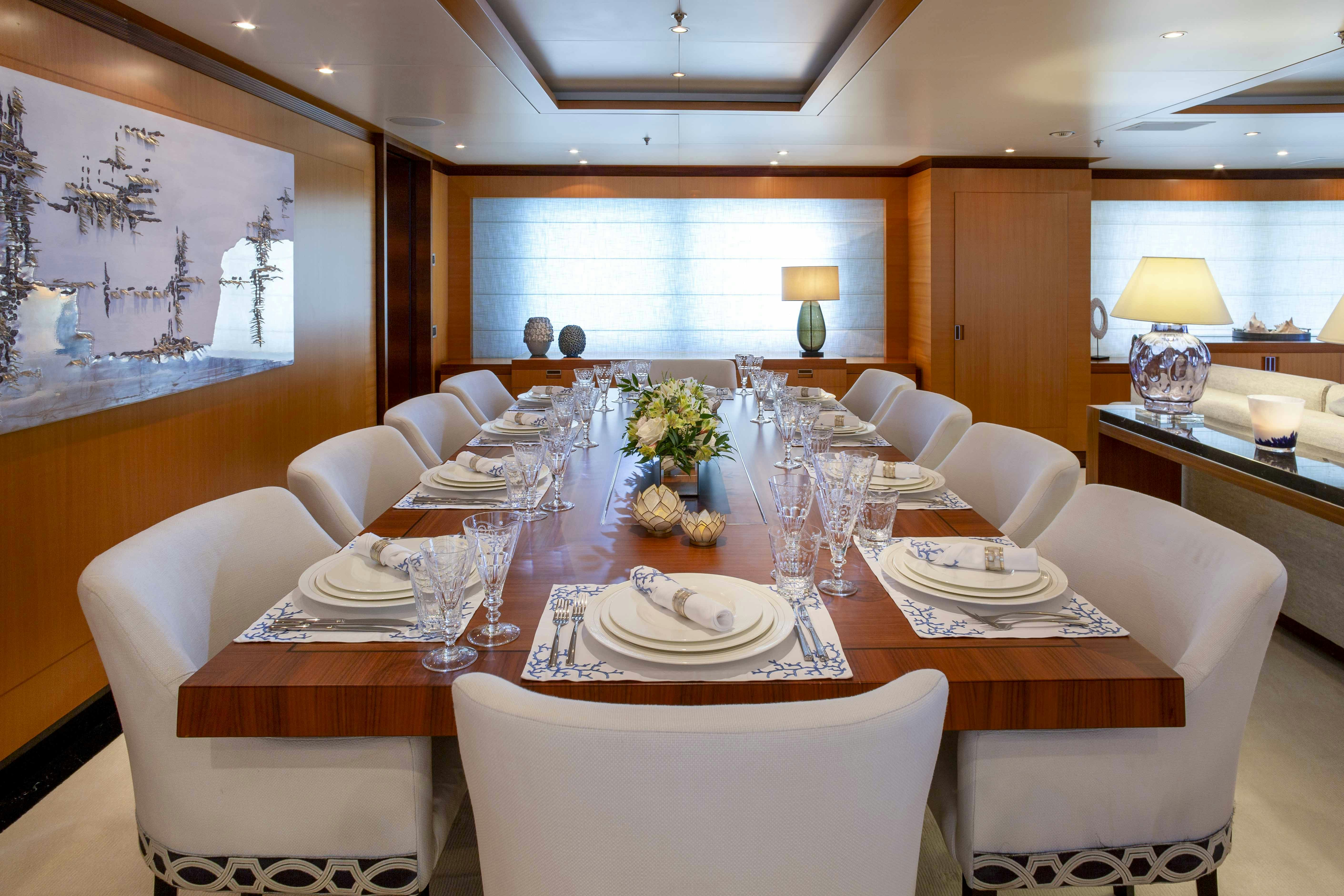 a dining room with a table set aboard LA BLANCA Yacht for Charter