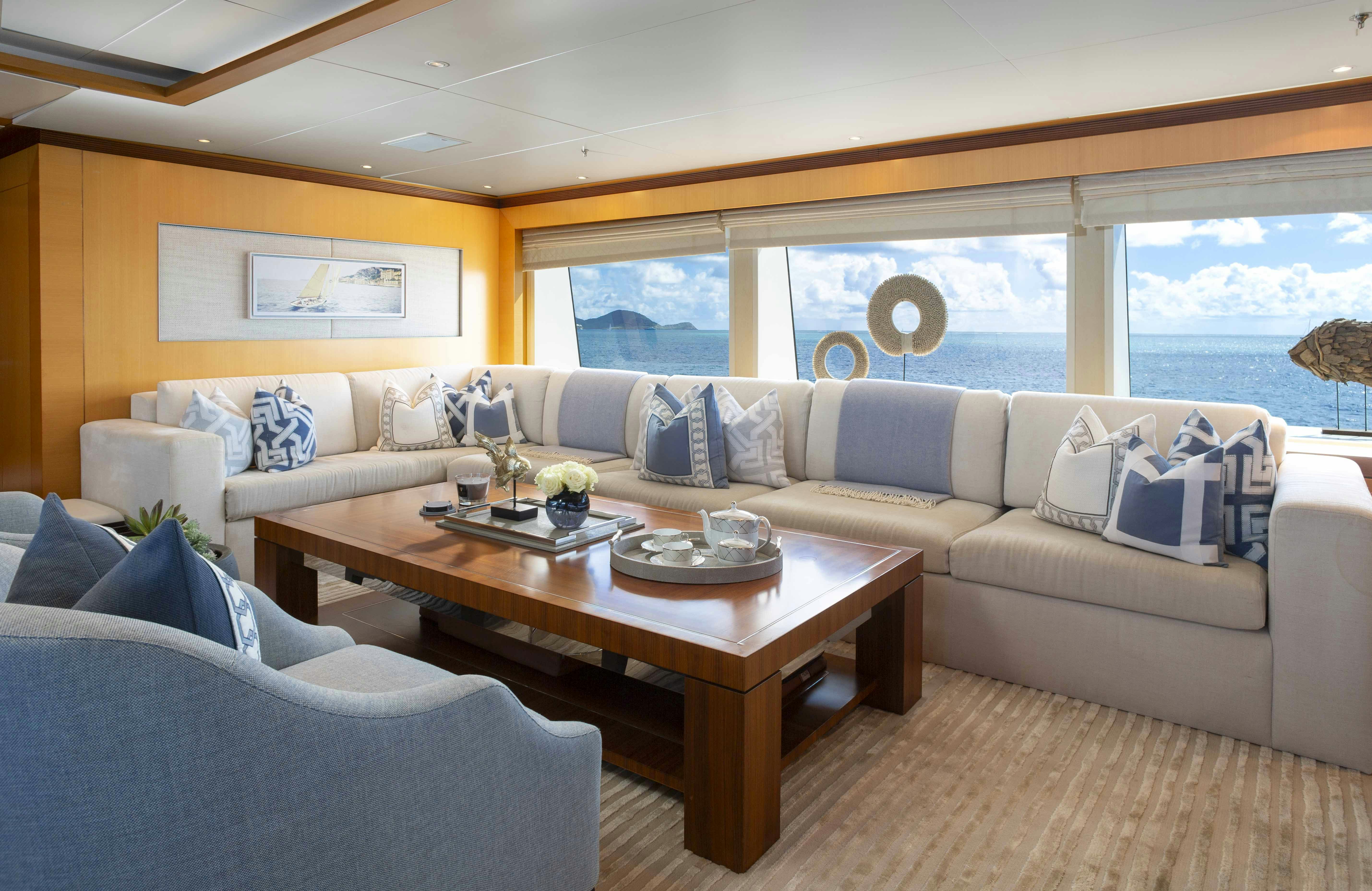 a living room with a large window aboard LA BLANCA Yacht for Charter