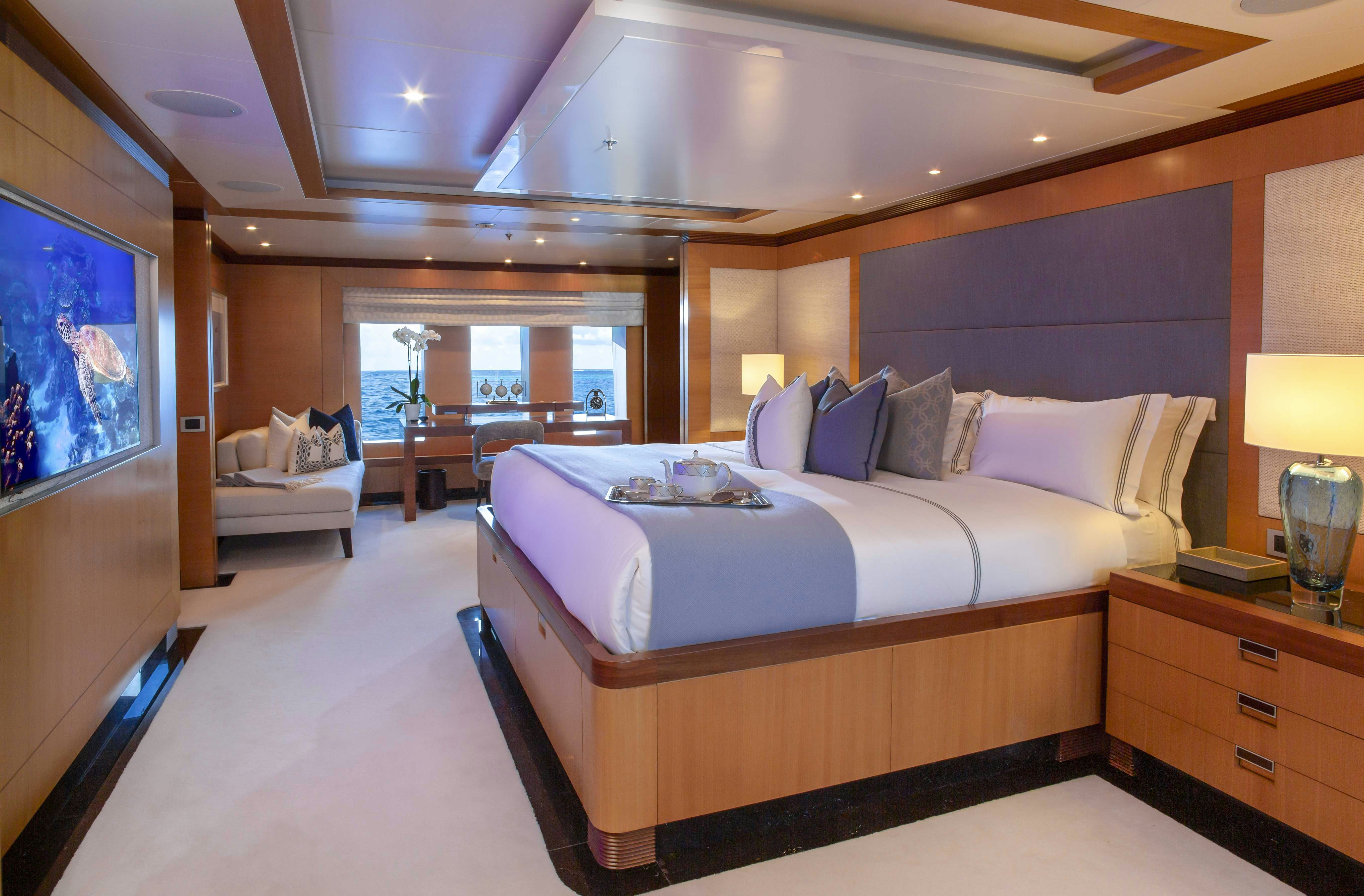 a large bedroom with a large bed aboard LA BLANCA Yacht for Charter
