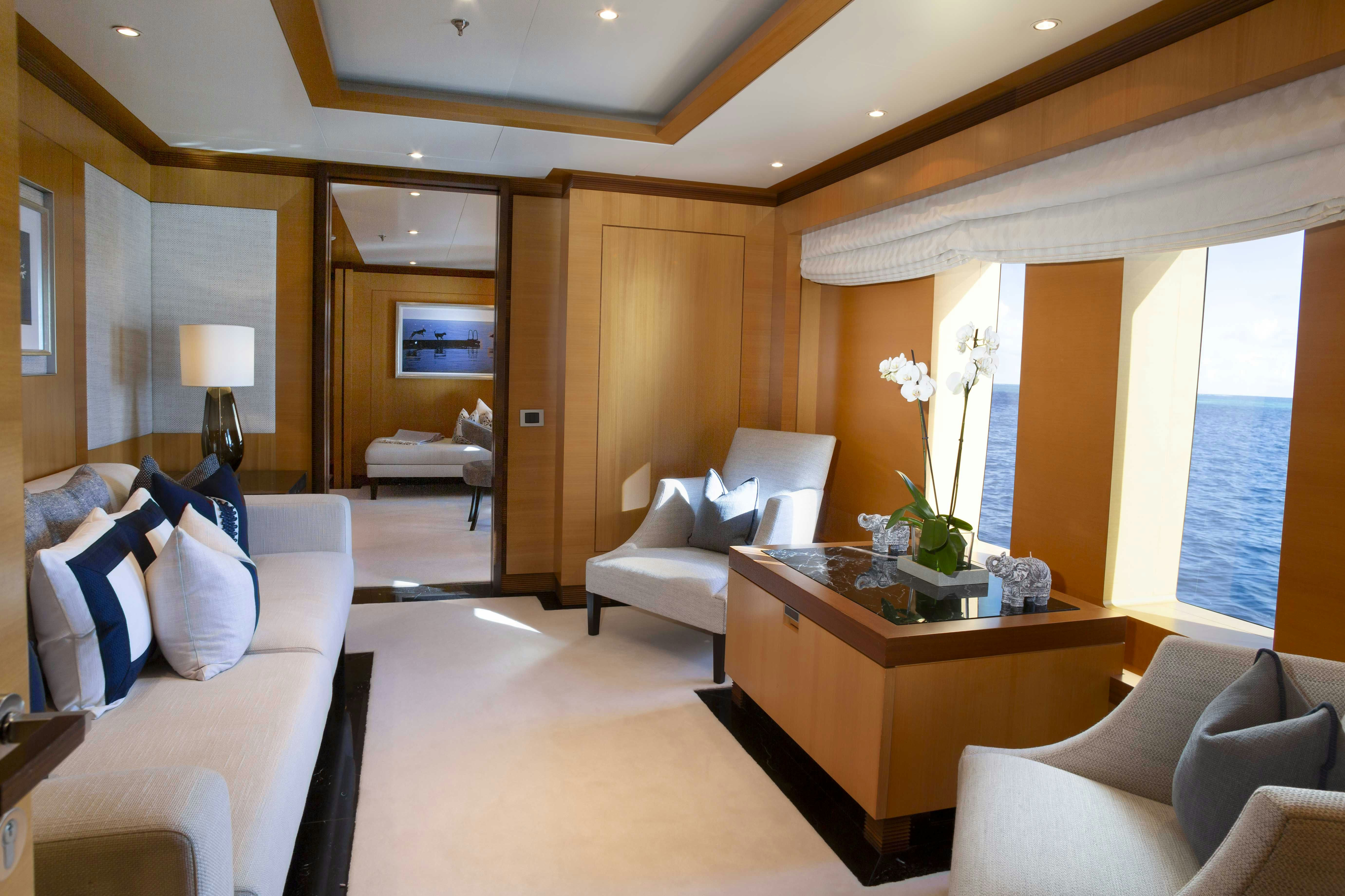 a living room with a large window aboard LA BLANCA Yacht for Charter