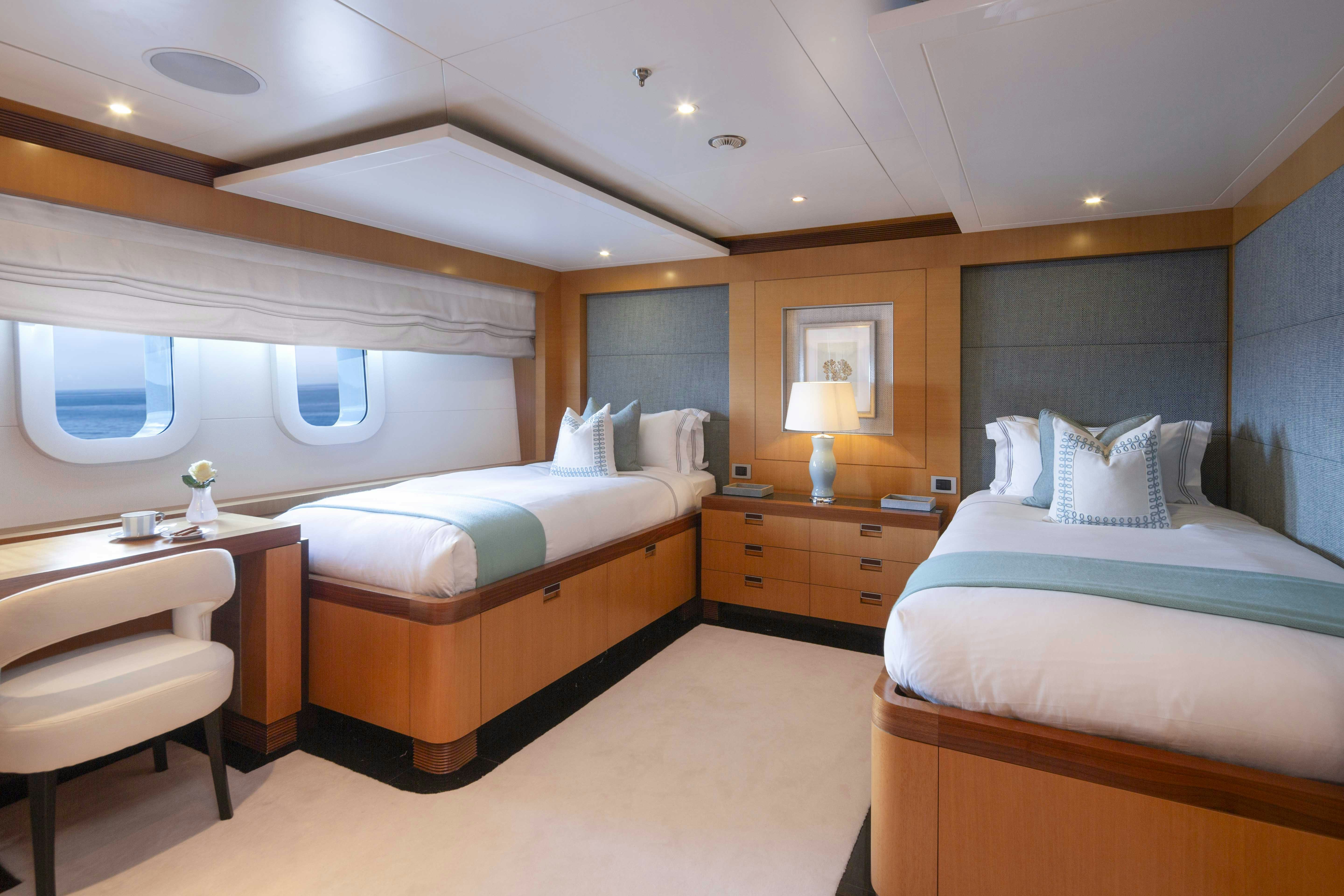 a room with two beds aboard LA BLANCA Yacht for Charter