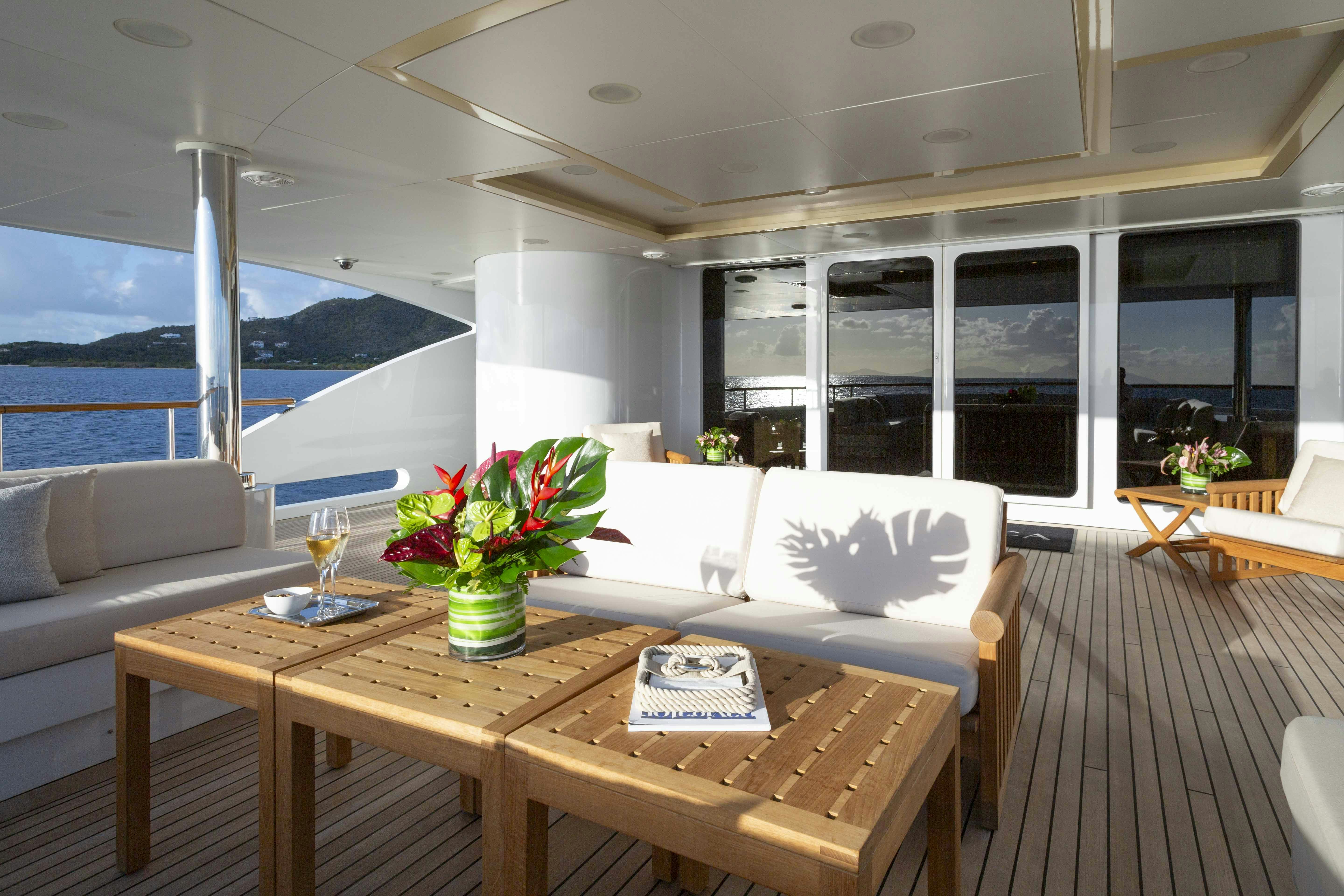 a room with a table and chairs aboard LA BLANCA Yacht for Charter