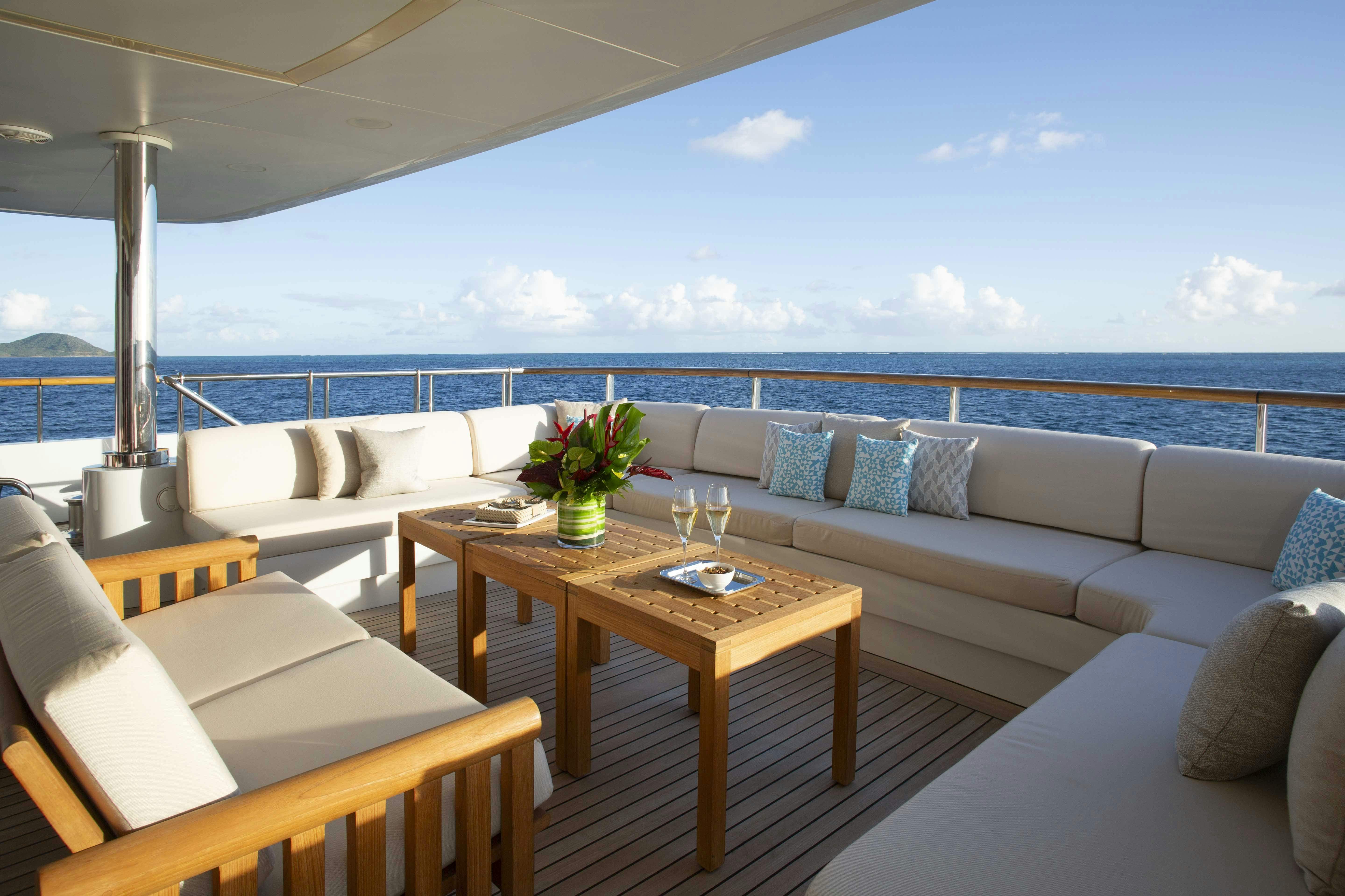 a living room with a large balcony aboard LA BLANCA Yacht for Charter