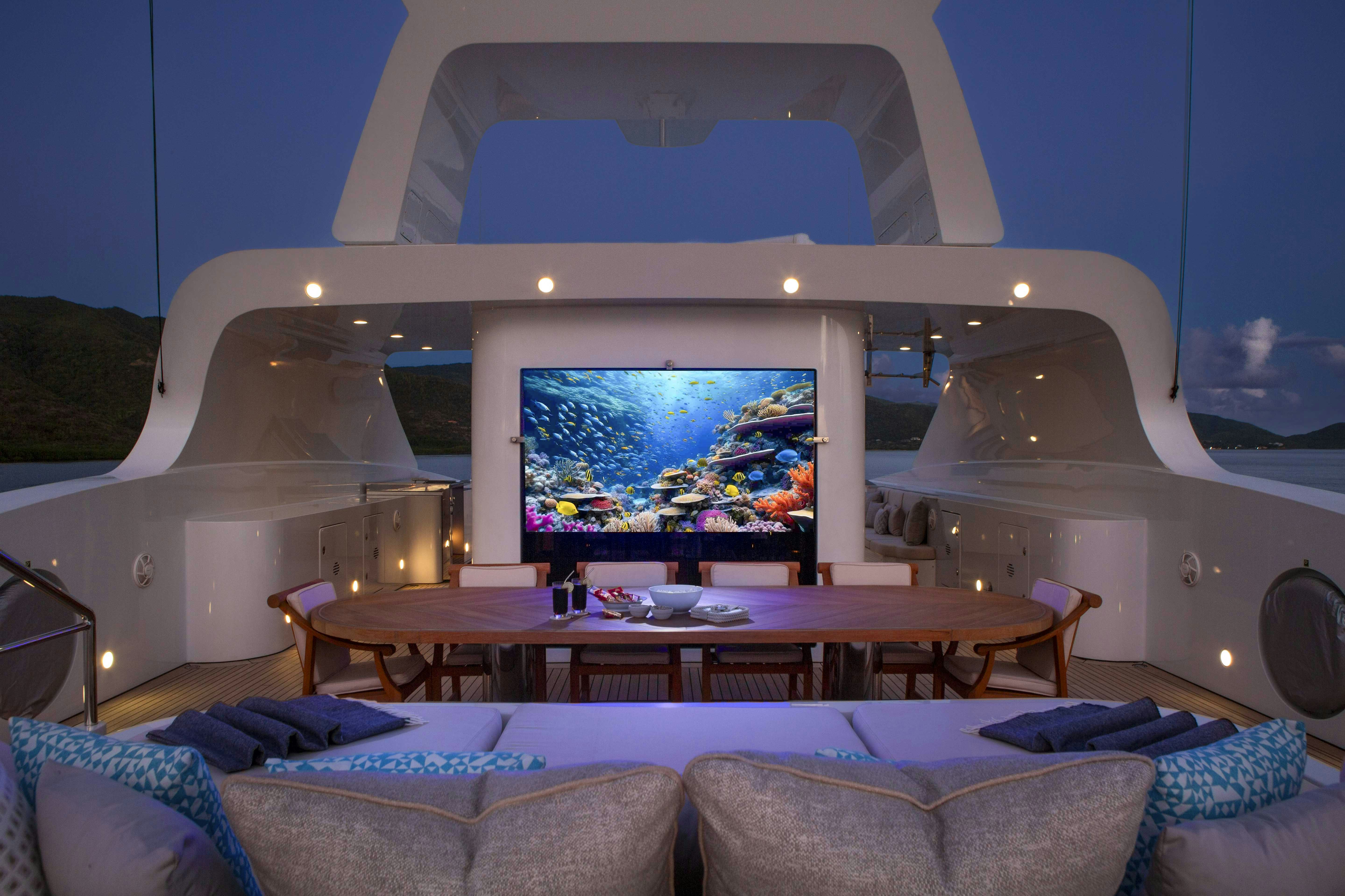 a room with a large screen aboard LA BLANCA Yacht for Charter