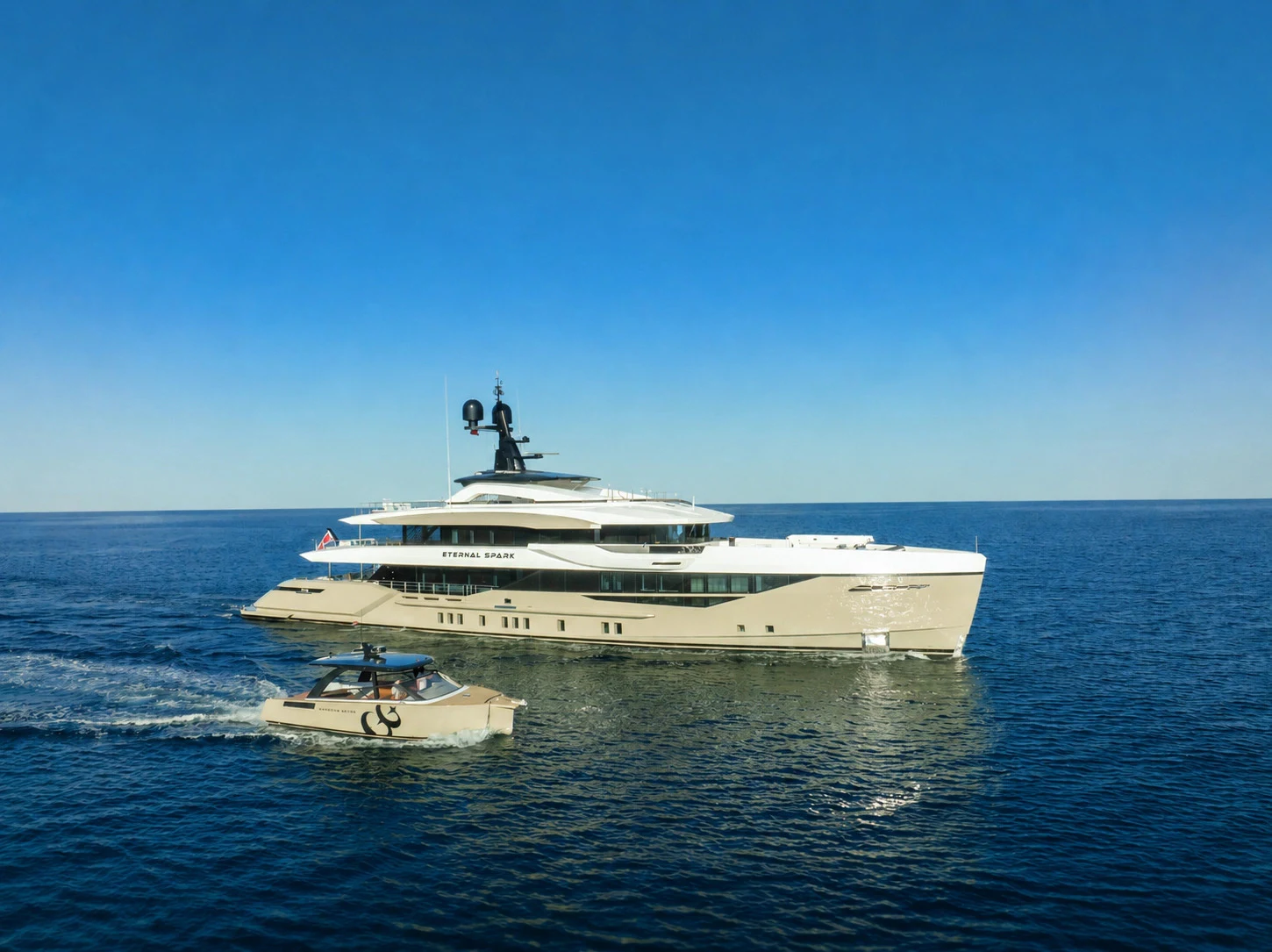 a large white ship with a smaller boat on it aboard ETERNAL SPARK Yacht for Charter