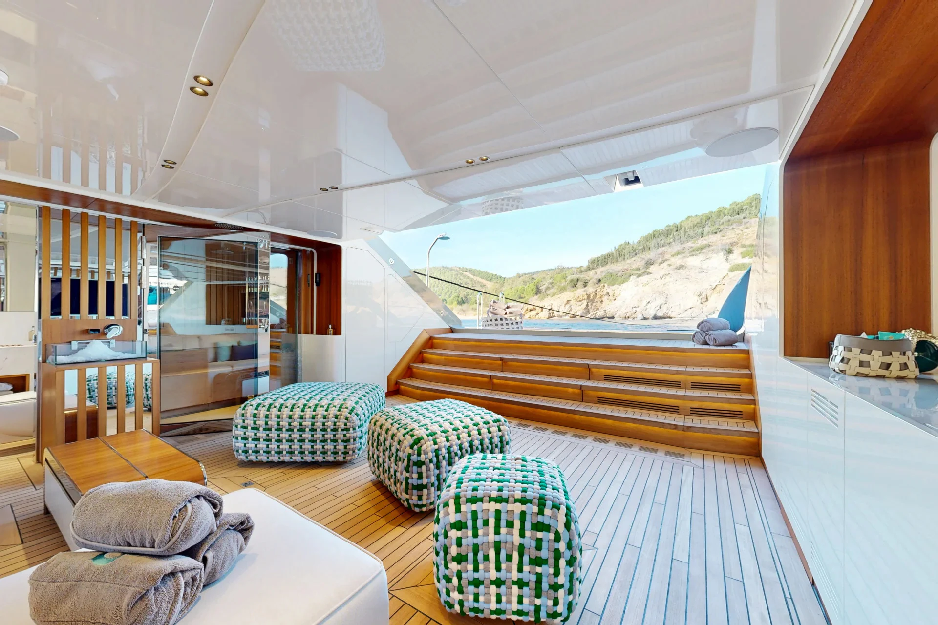 a living room with a large balcony aboard ETERNAL SPARK Yacht for Charter