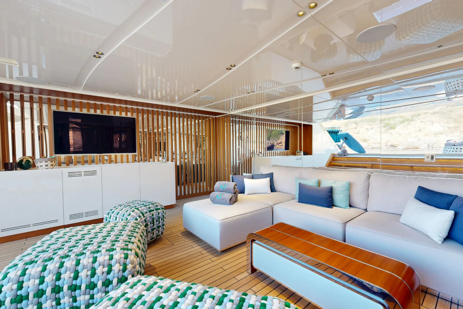 a living room with a large television aboard ETERNAL SPARK Yacht for Charter