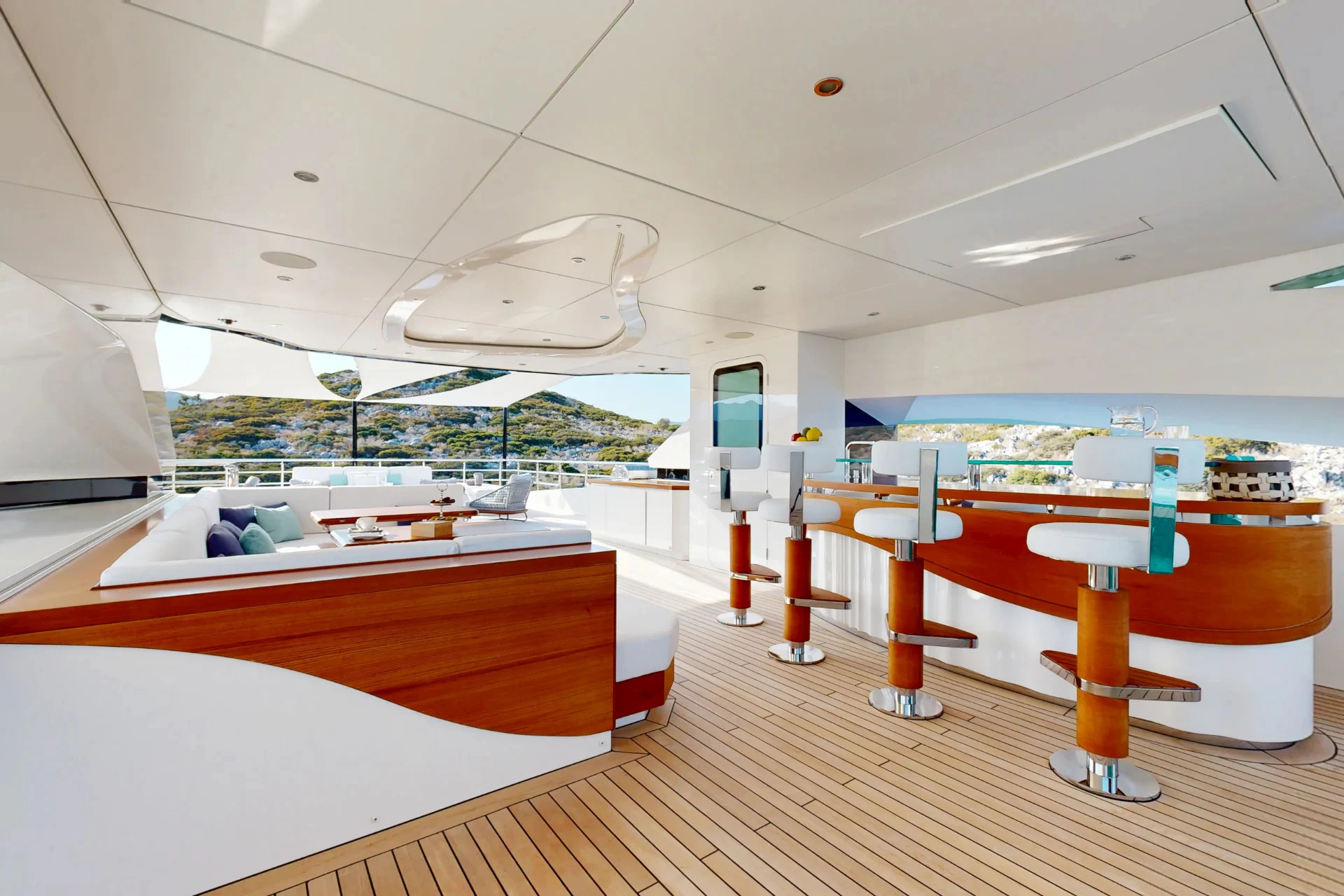 a room with a large window and a table with chairs and a large white ceiling aboard ETERNAL SPARK Yacht for Charter
