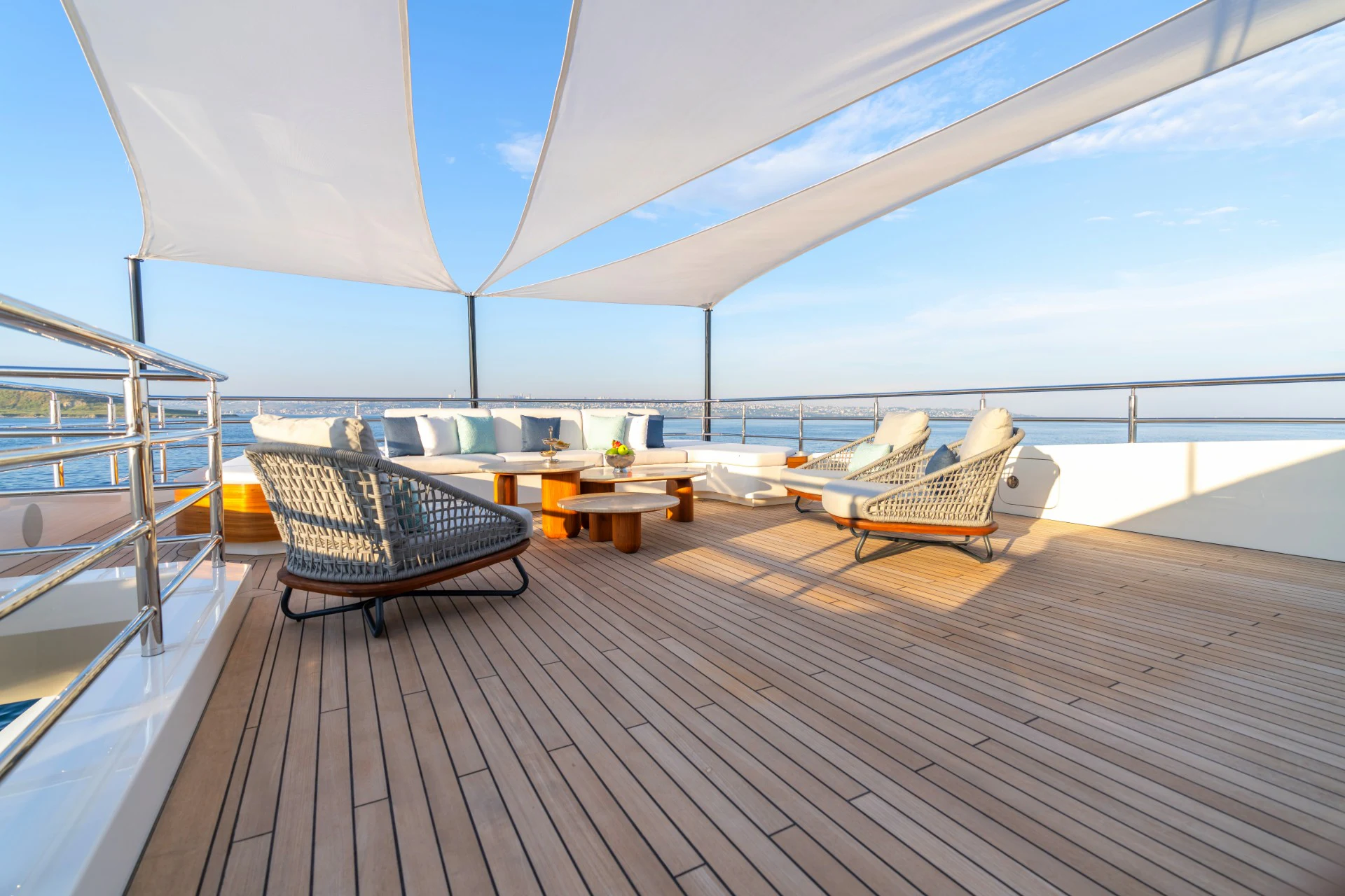 a deck with a view of the ocean and a deck aboard ETERNAL SPARK Yacht for Charter
