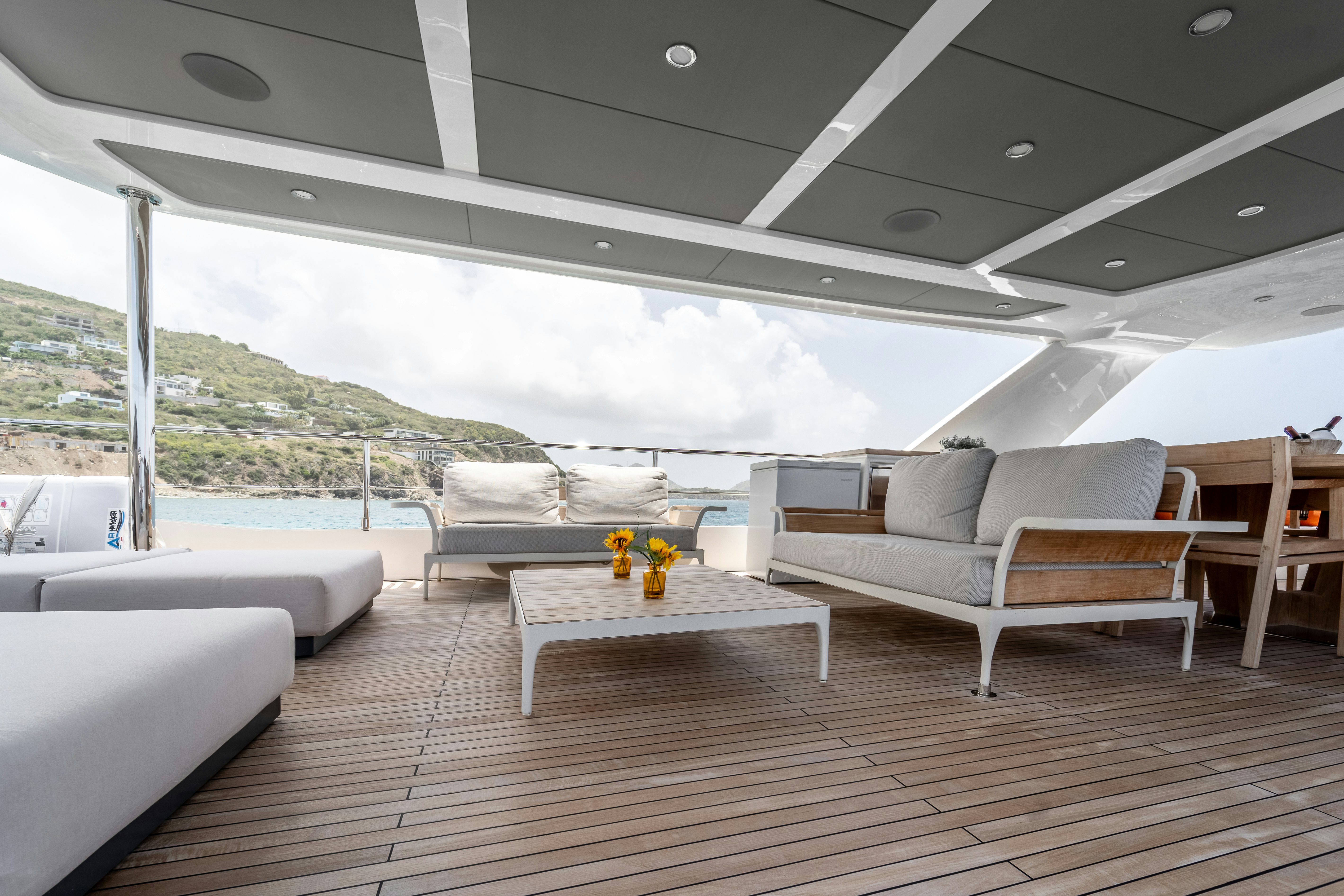 a room with couches and a table aboard EXIT STRATEGY Yacht for Sale