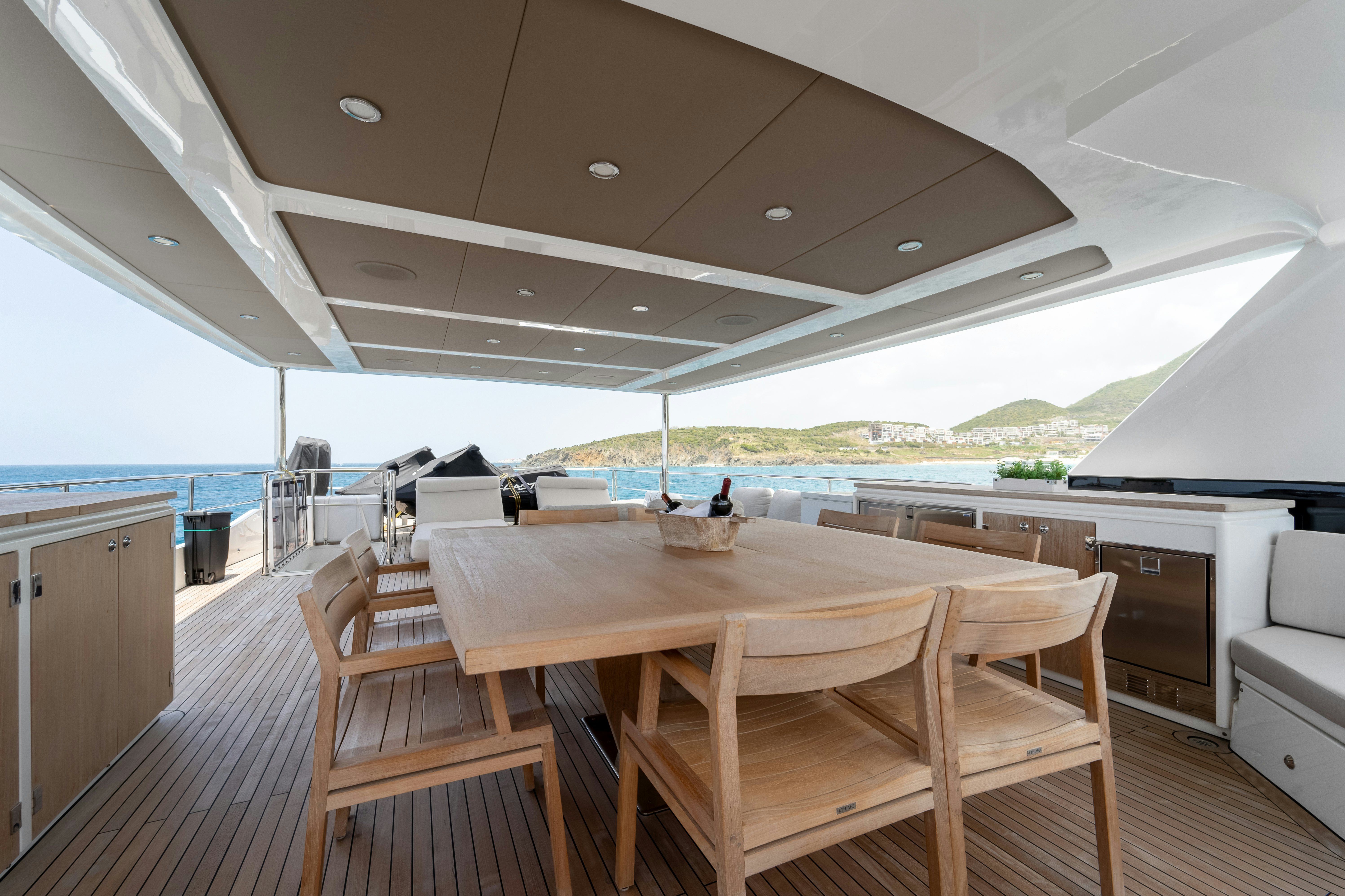 a large open space with a table and chairs and a large open space aboard EXIT STRATEGY Yacht for Sale