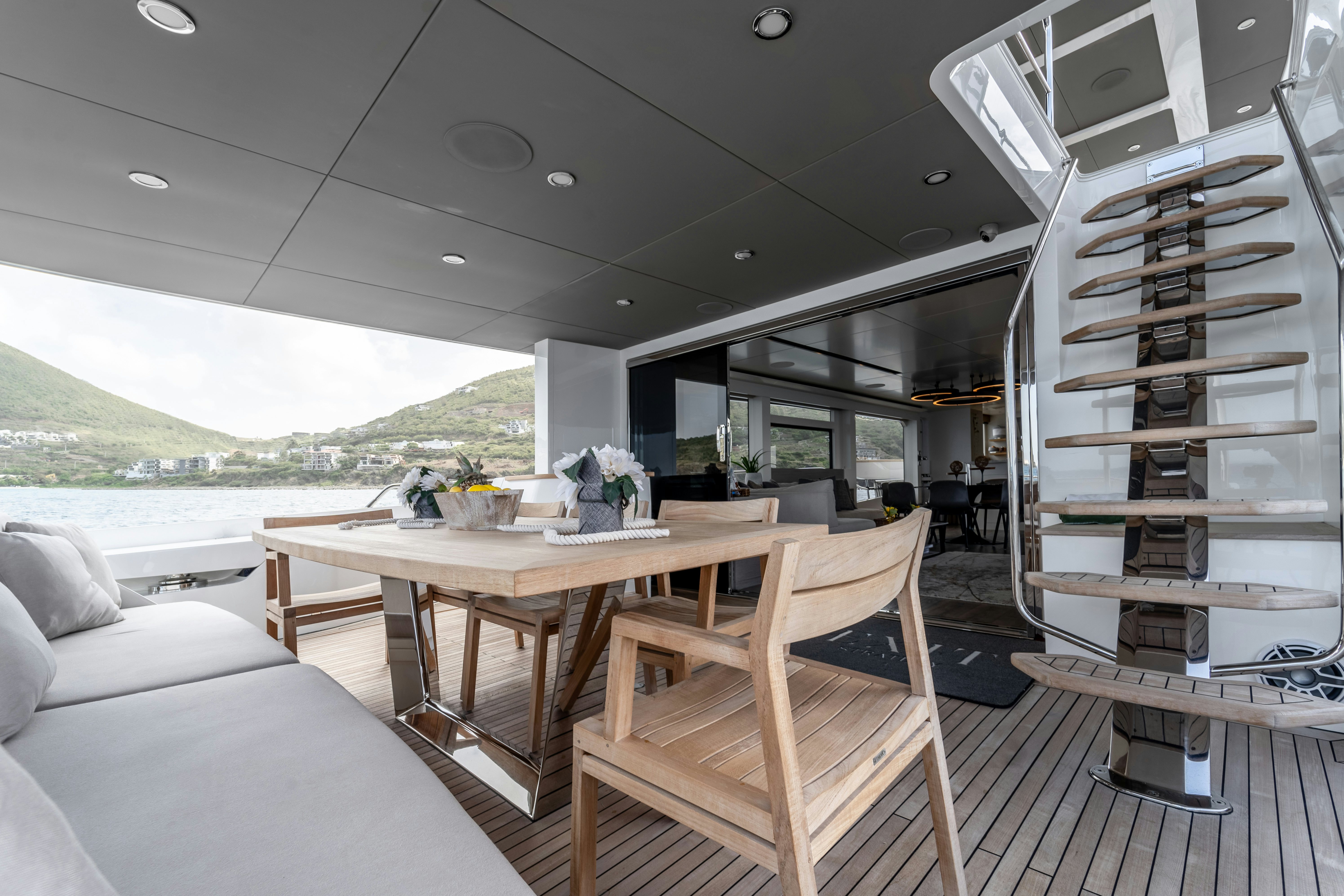 a room with a table and chairs aboard EXIT STRATEGY Yacht for Sale
