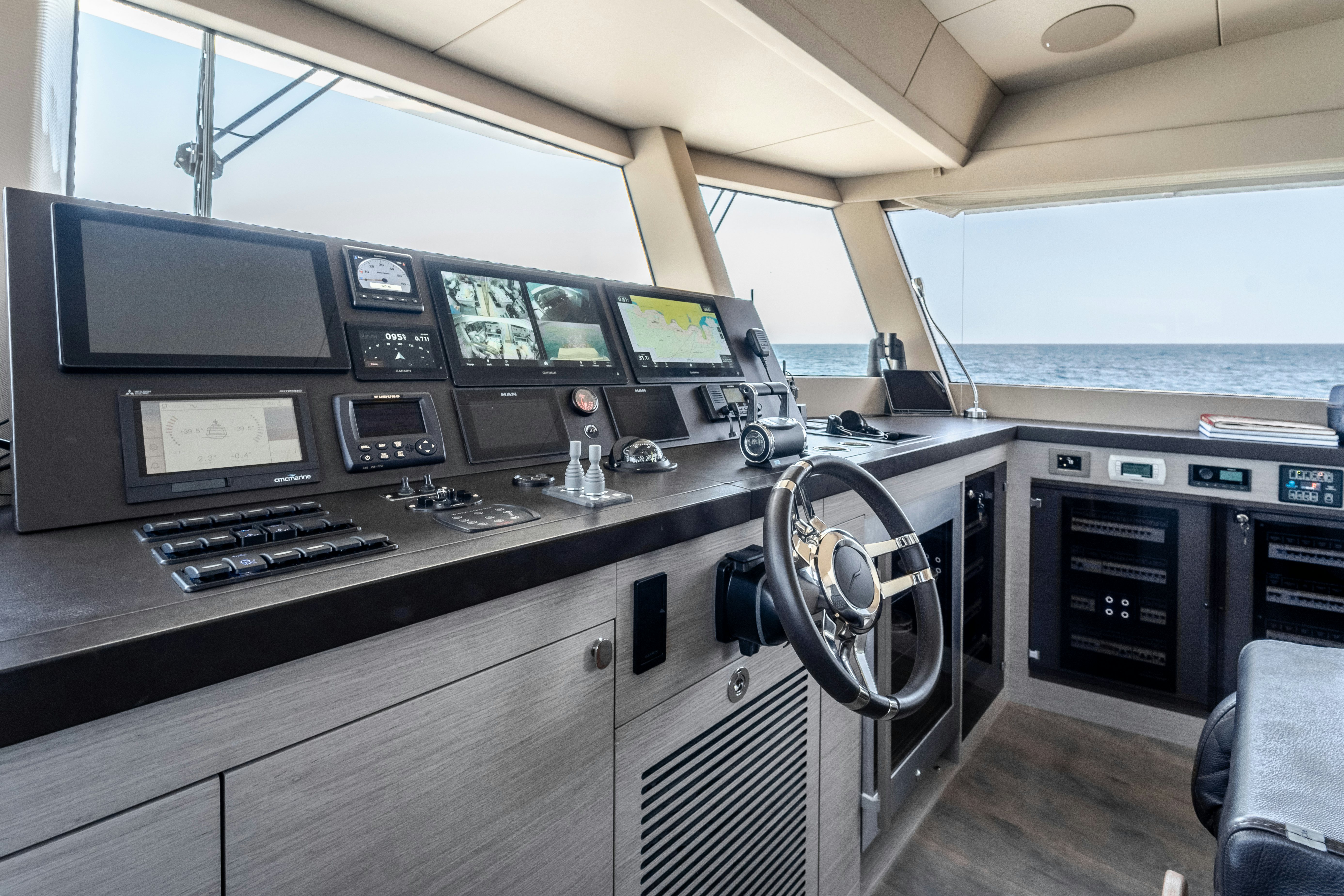 a room with many monitors and electronics aboard EXIT STRATEGY Yacht for Sale